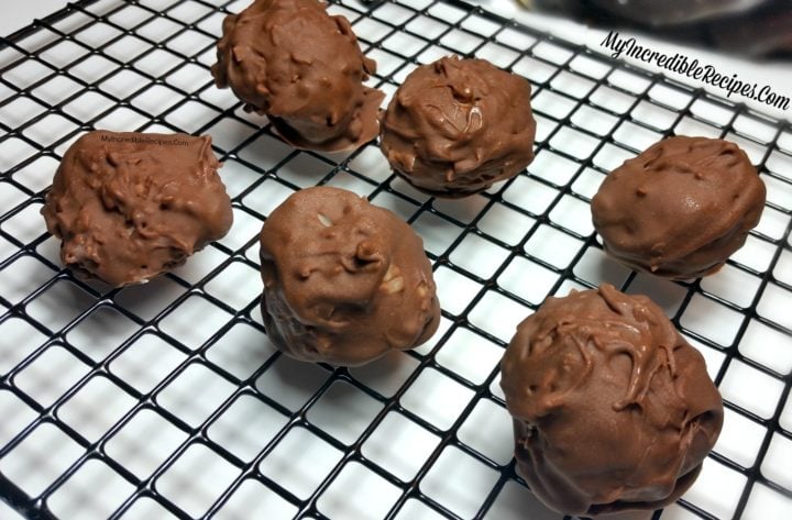Mounds Coconut Copycat Chocolate Balls on a wire cooling rack