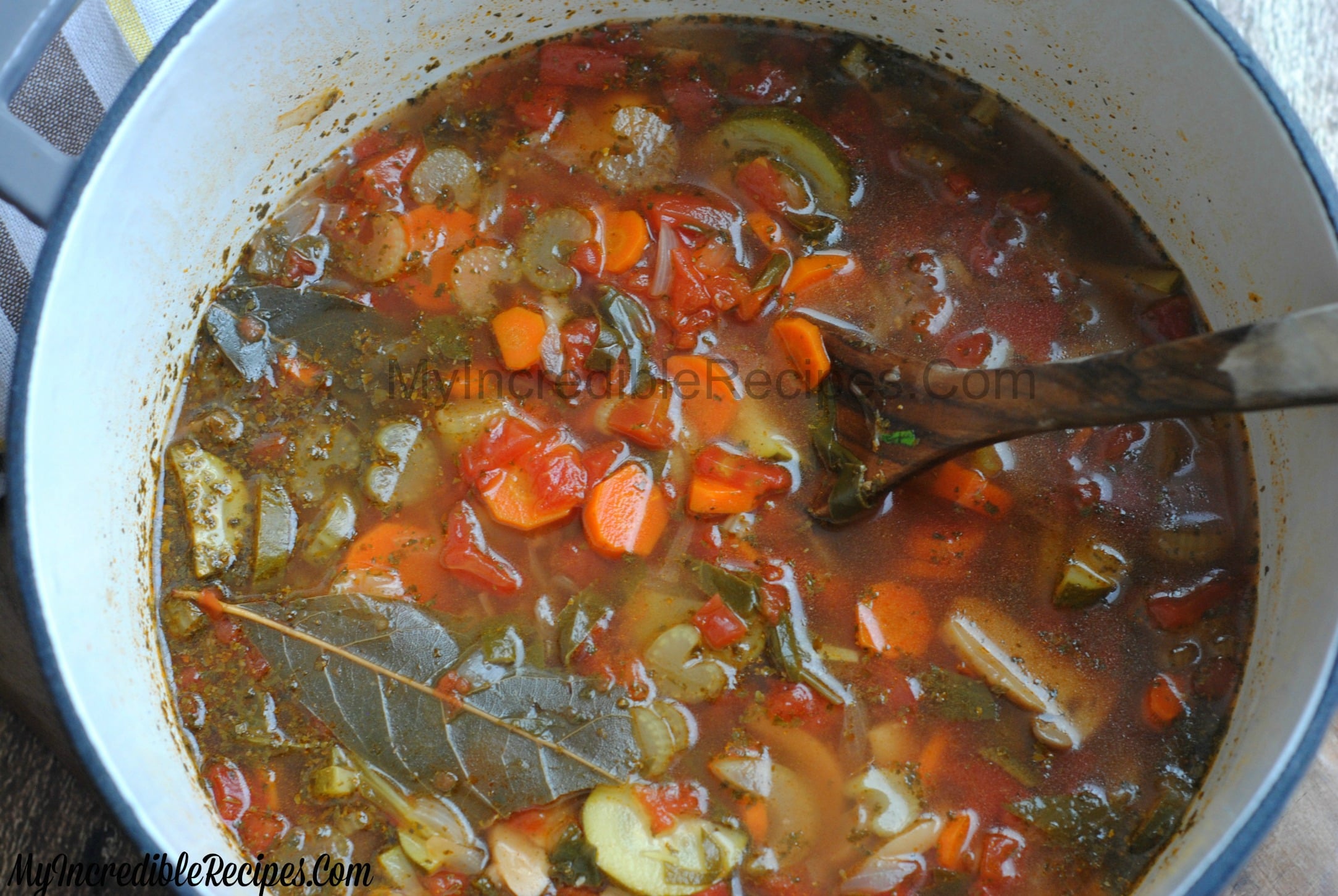 Weight loss soup in a dutch oven pot on a dark wood table 