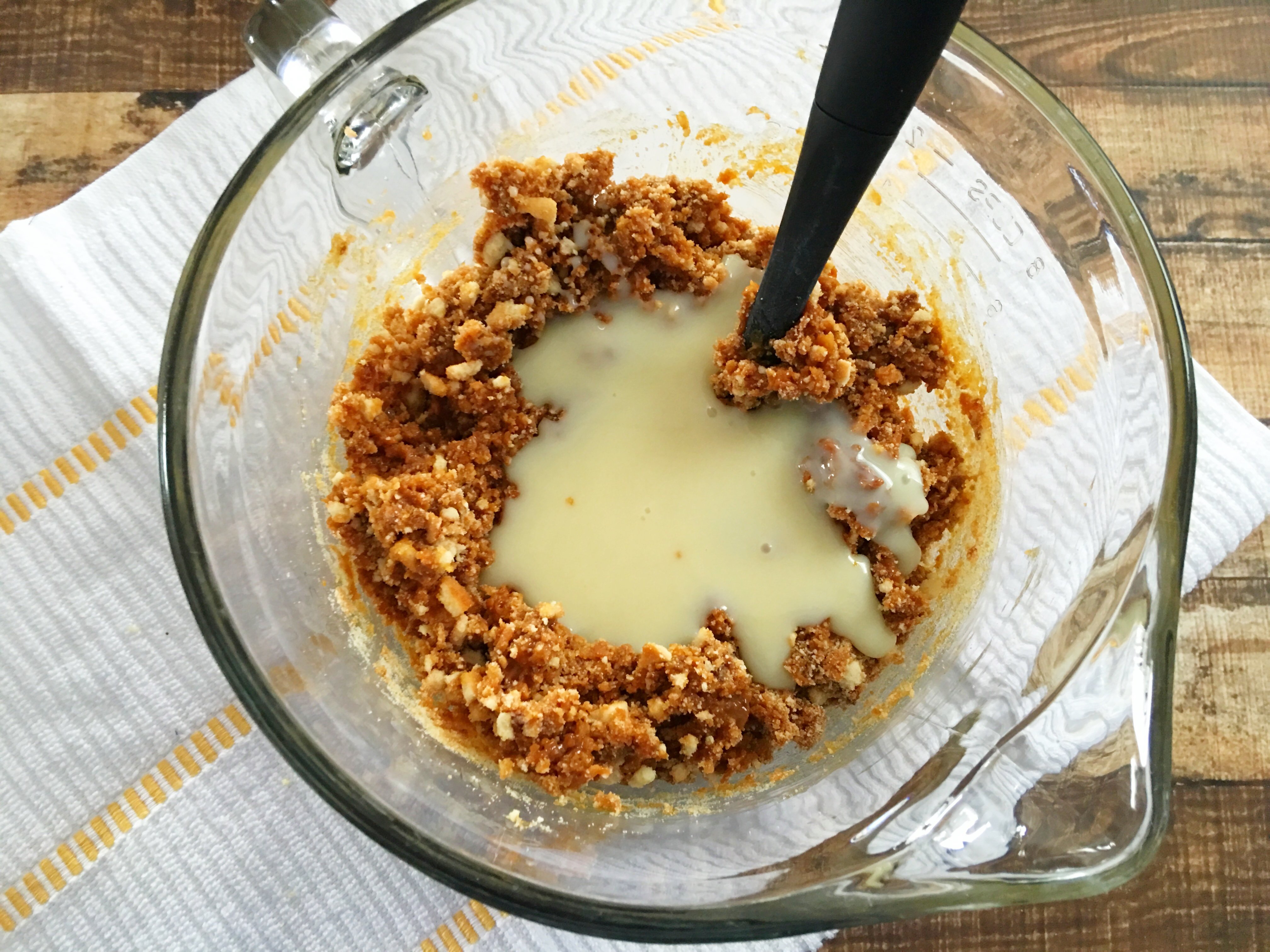 Samoa Bites being mixed in a mixing bowl with dulce de leche