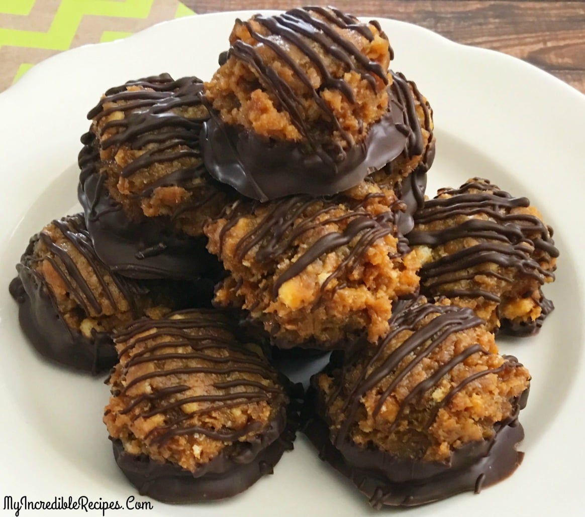 Samoa Bites on a white plate on a dark wood table