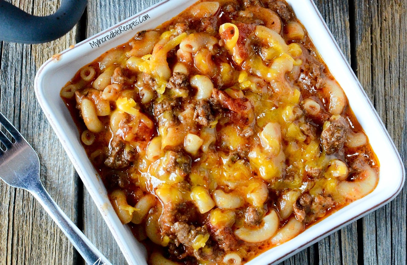 Old Fashioned Goulash in a white square bowl on a wood table