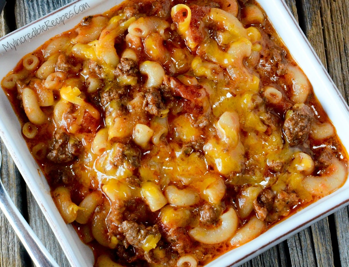 Old Fashioned Goulash in a white bowl on a wood table