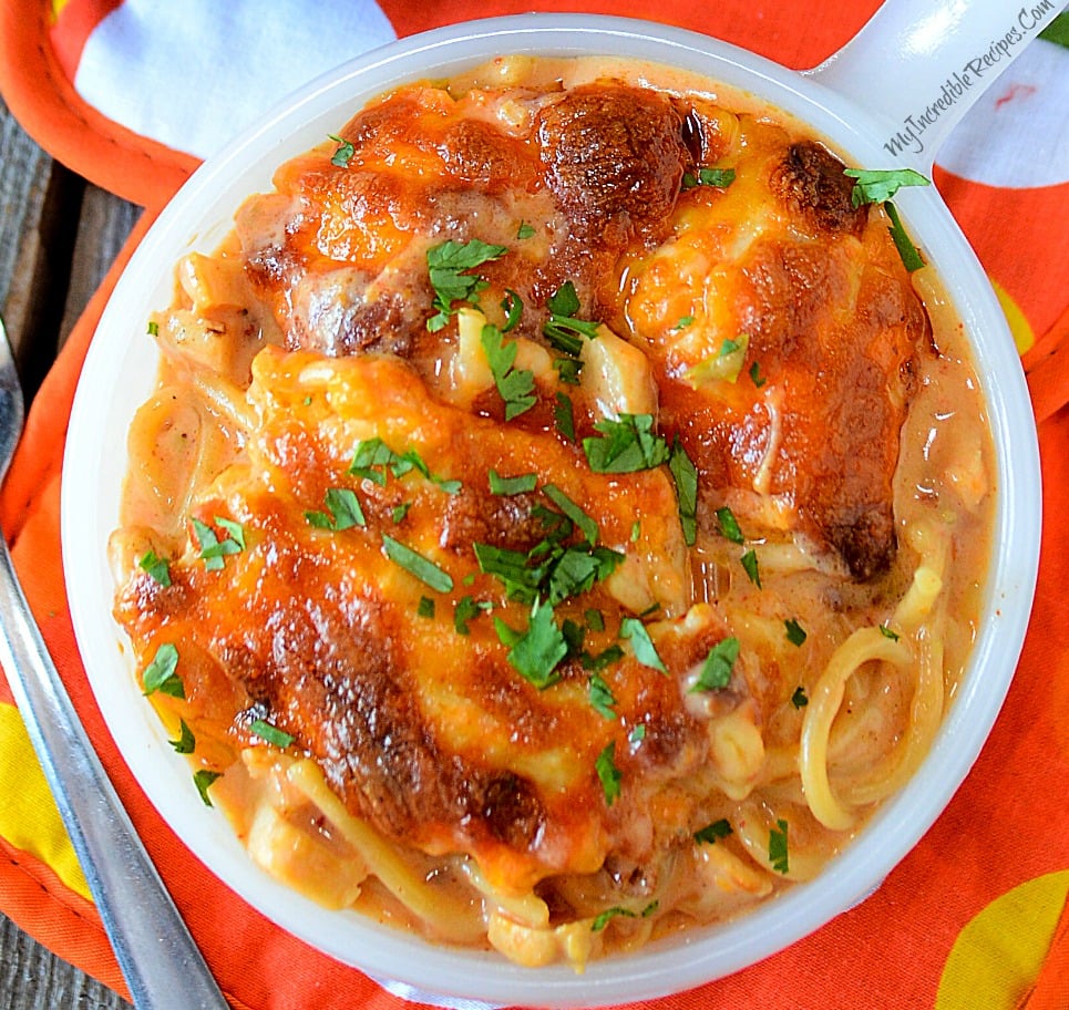 up close shot of Cheesy Chicken Spaghetti in a white bowl