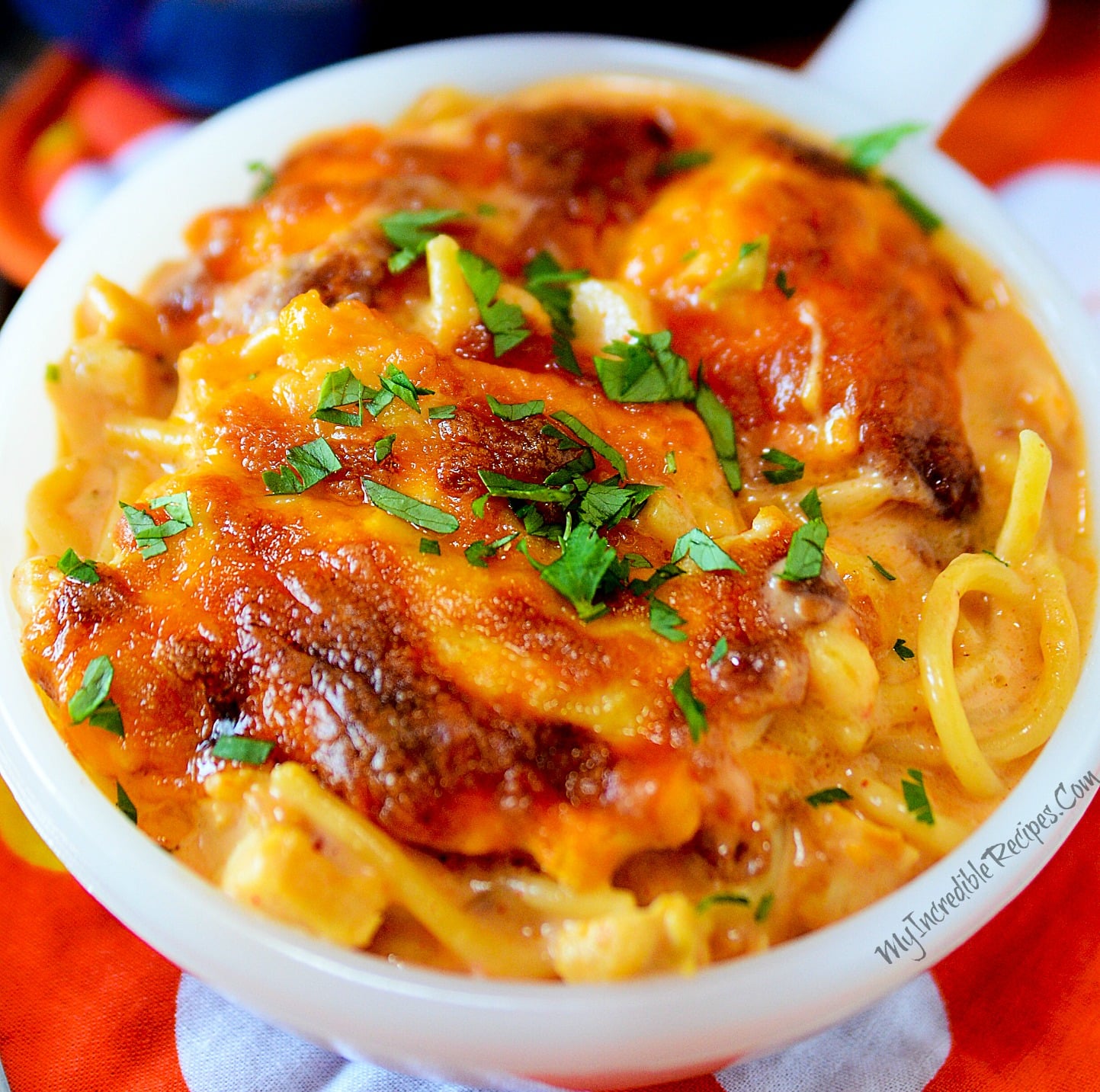 Cheesy Chicken Spaghetti in a white bowl close up