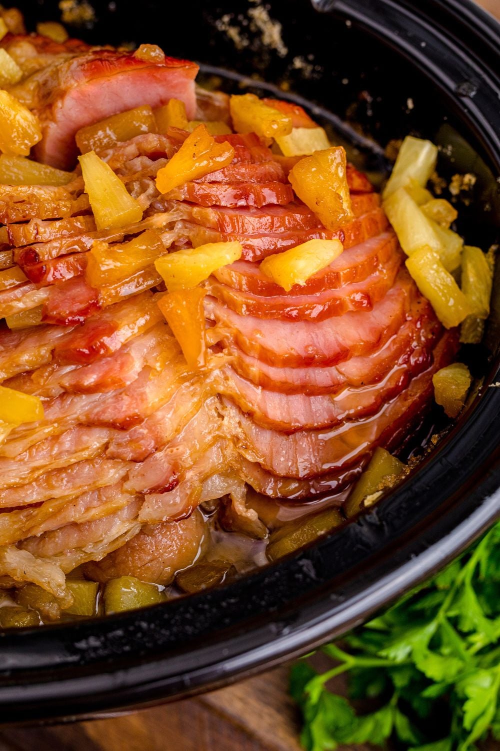 side view of ham in a slow cooker