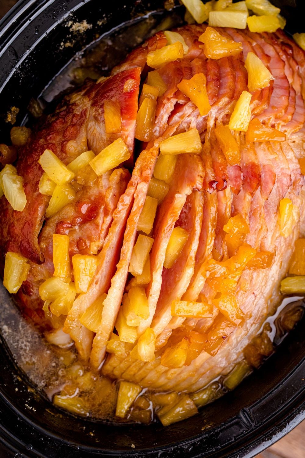 overhead shot of ham and pineapple in crockpot