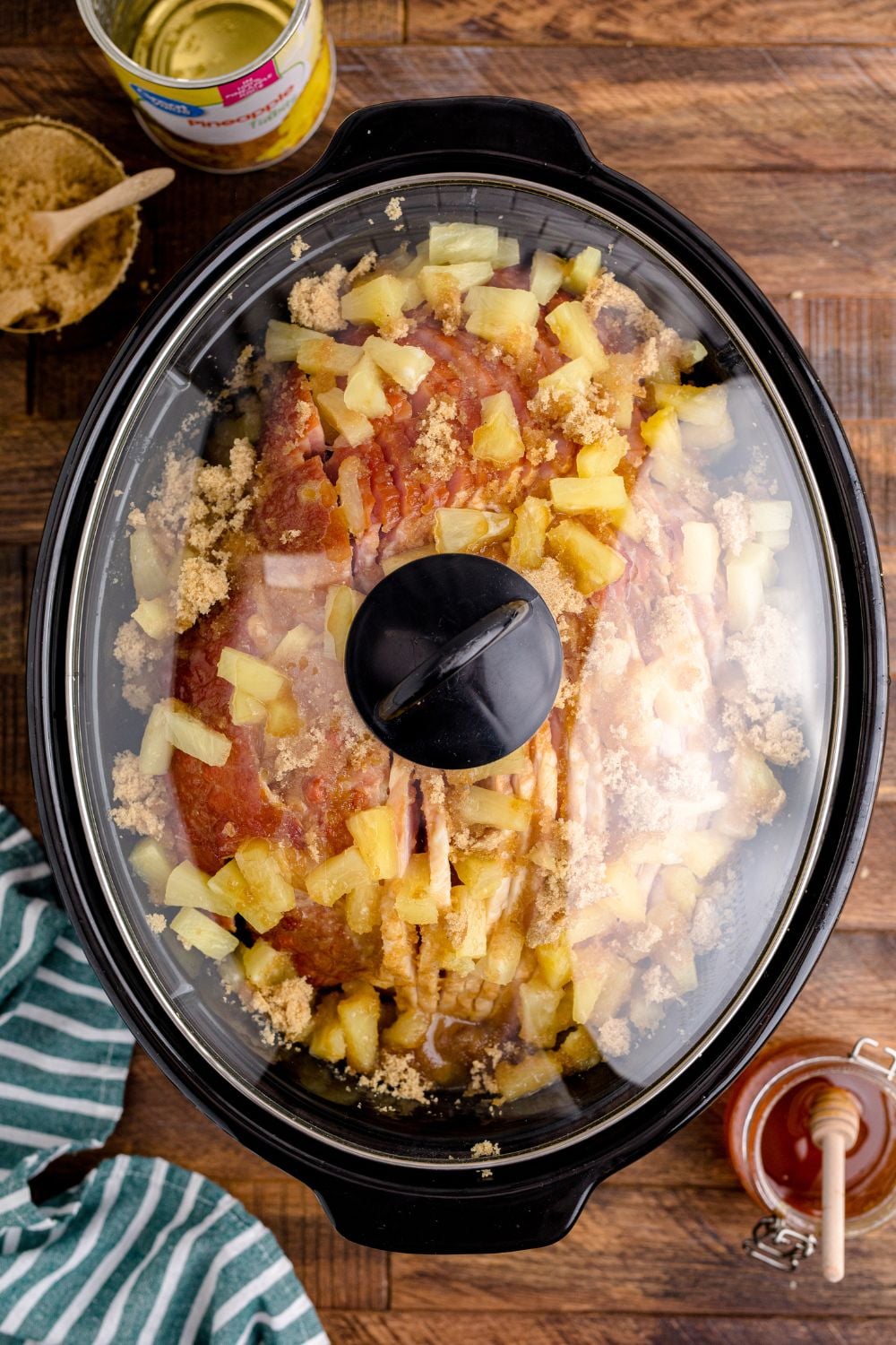 ham in a slow cooker with a lid on it