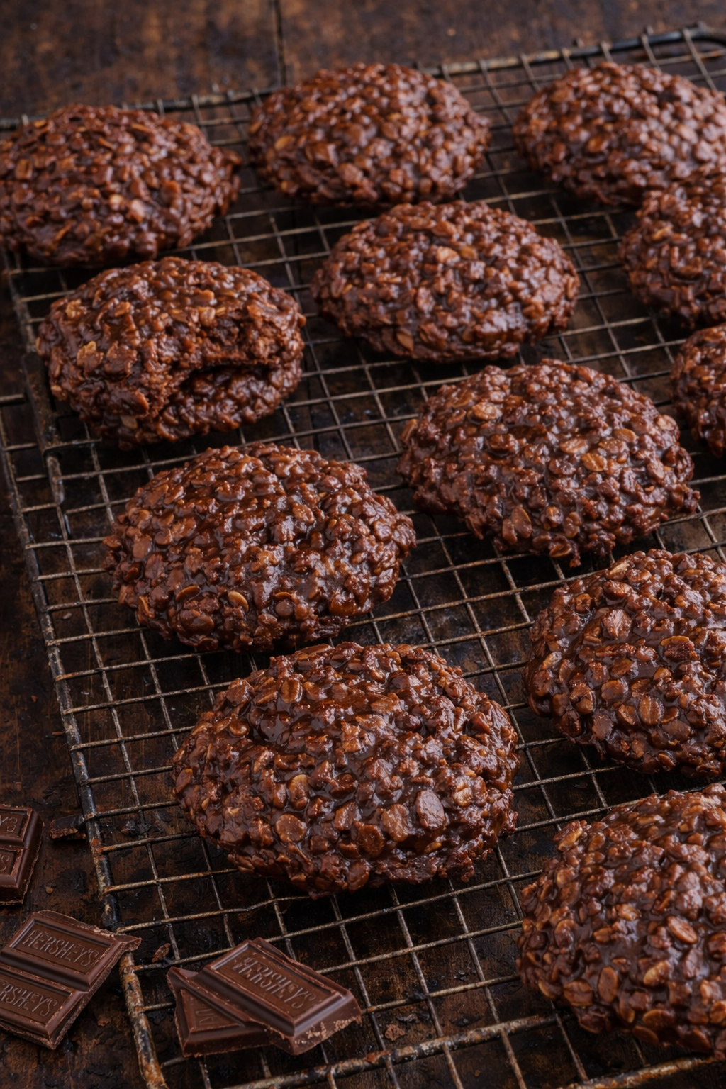 Chocolate Peanut Butter No Bake Cookies on a wire racked on a dark table