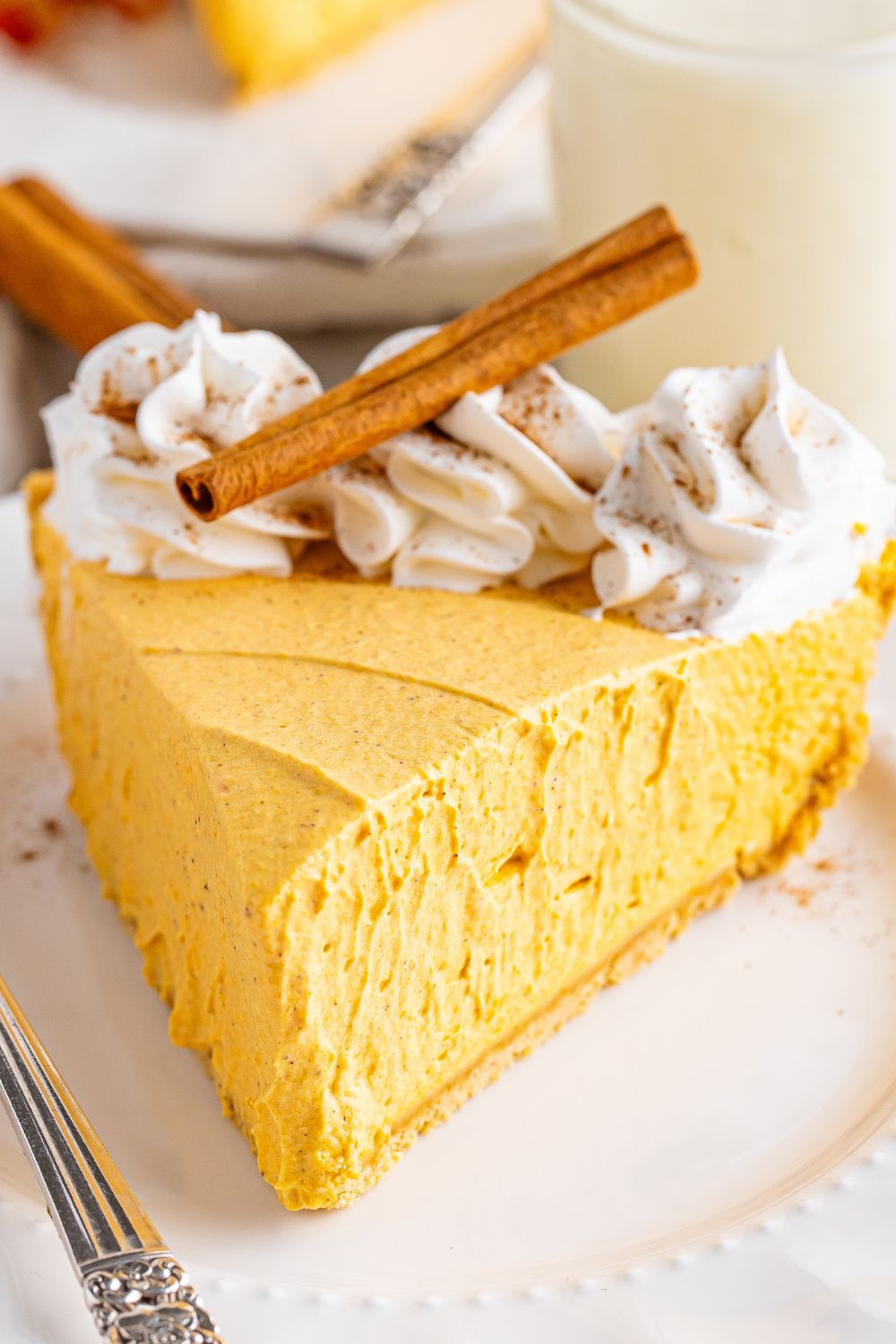plate with a slice of cheesecake on it