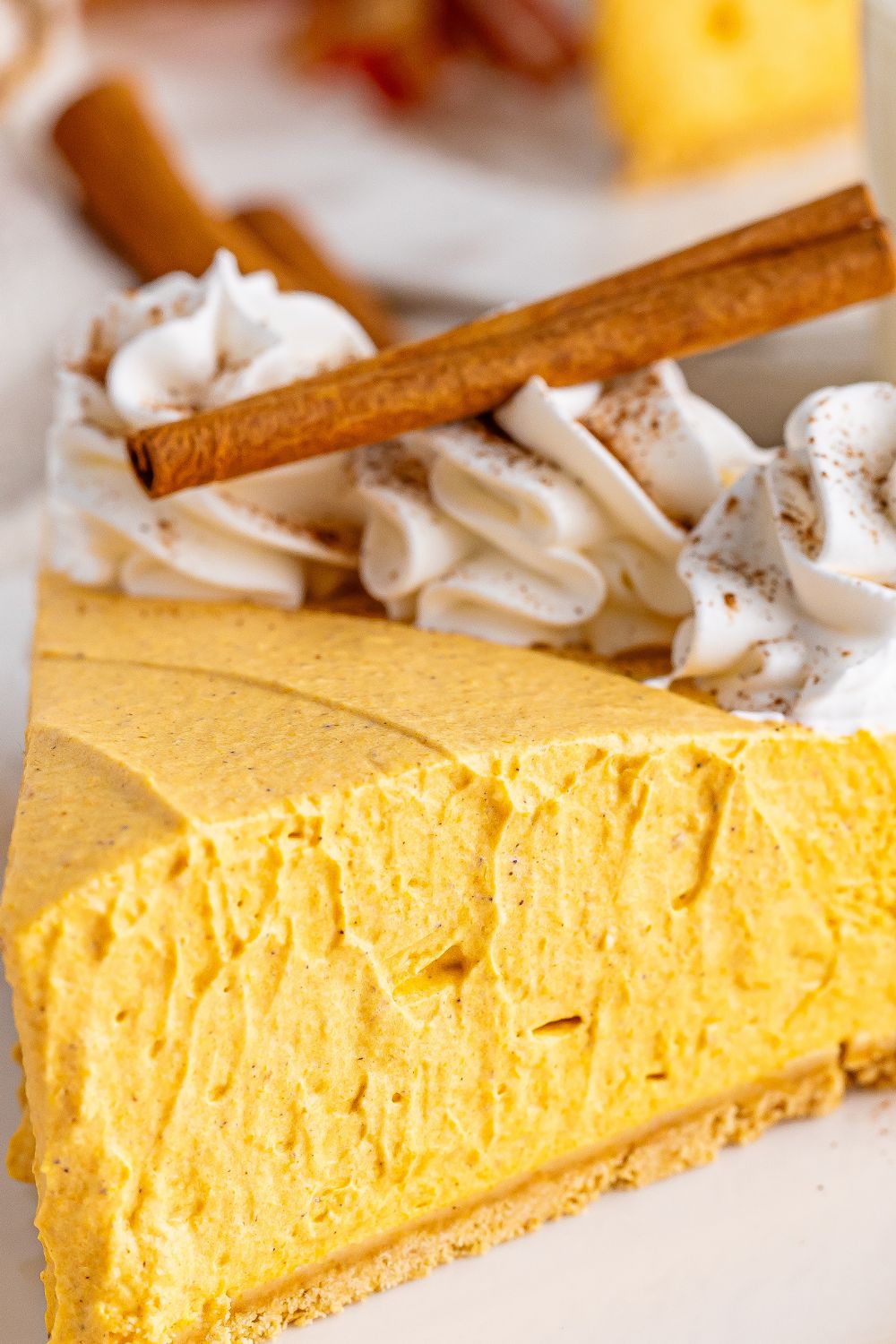 slice of pumpkin cheesecake on plate