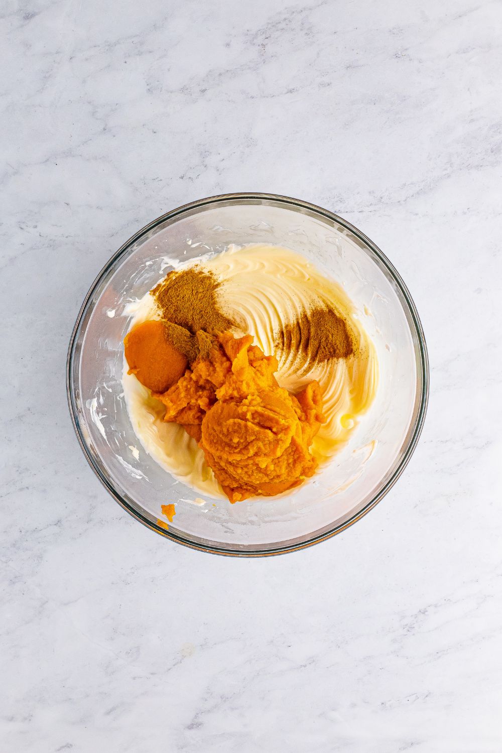 cheesecake batter filling in a glass bowl