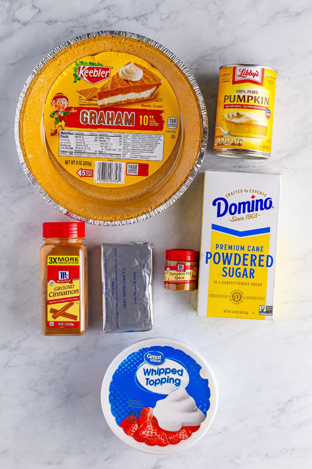 pumpkin spice cheesecake ingredients on table