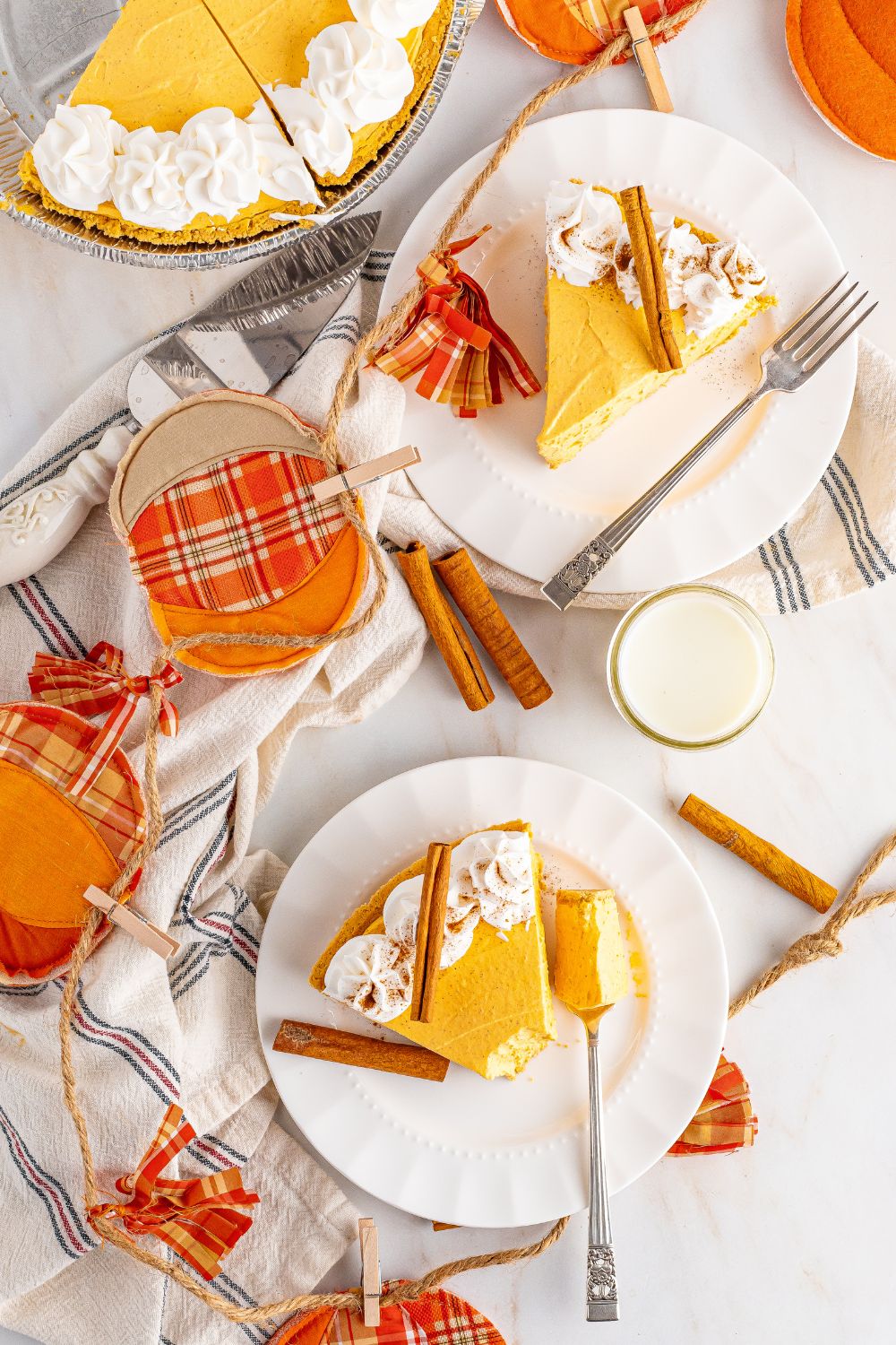 pumpkin cheesecake on plates on table 