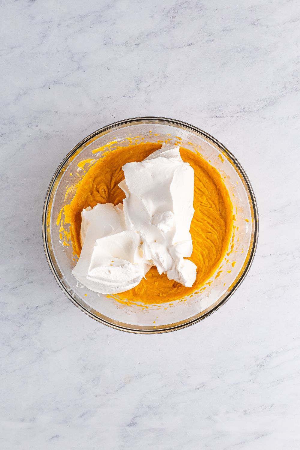 pumpkin cheesecake with whipped cream on top