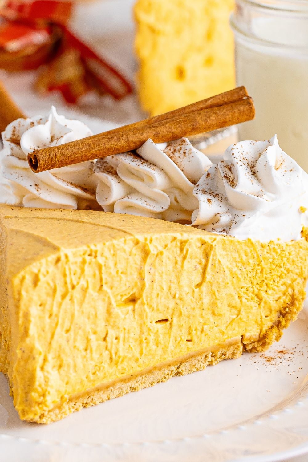 pumpkin spice cheesecake sliced on plate