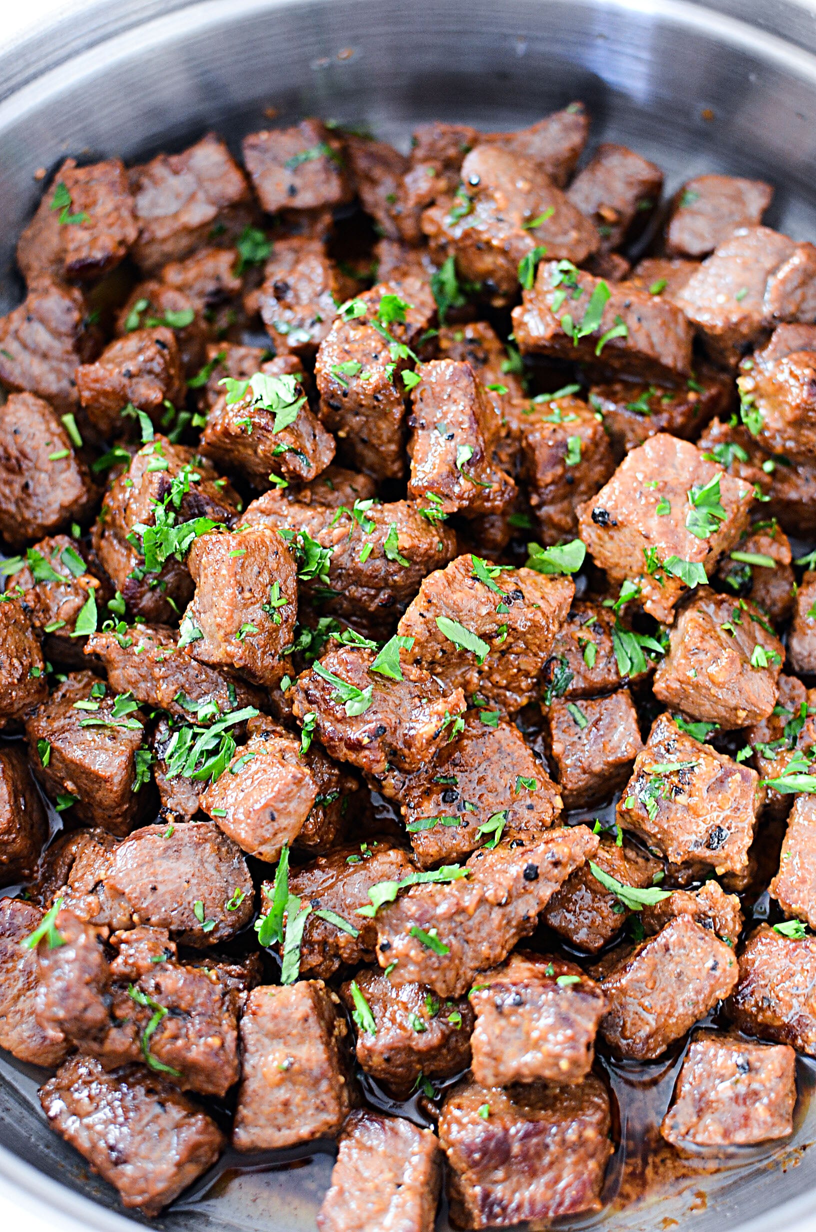 Juicy Garlic Butter Steak Bites in a skillet covered in garlic butter