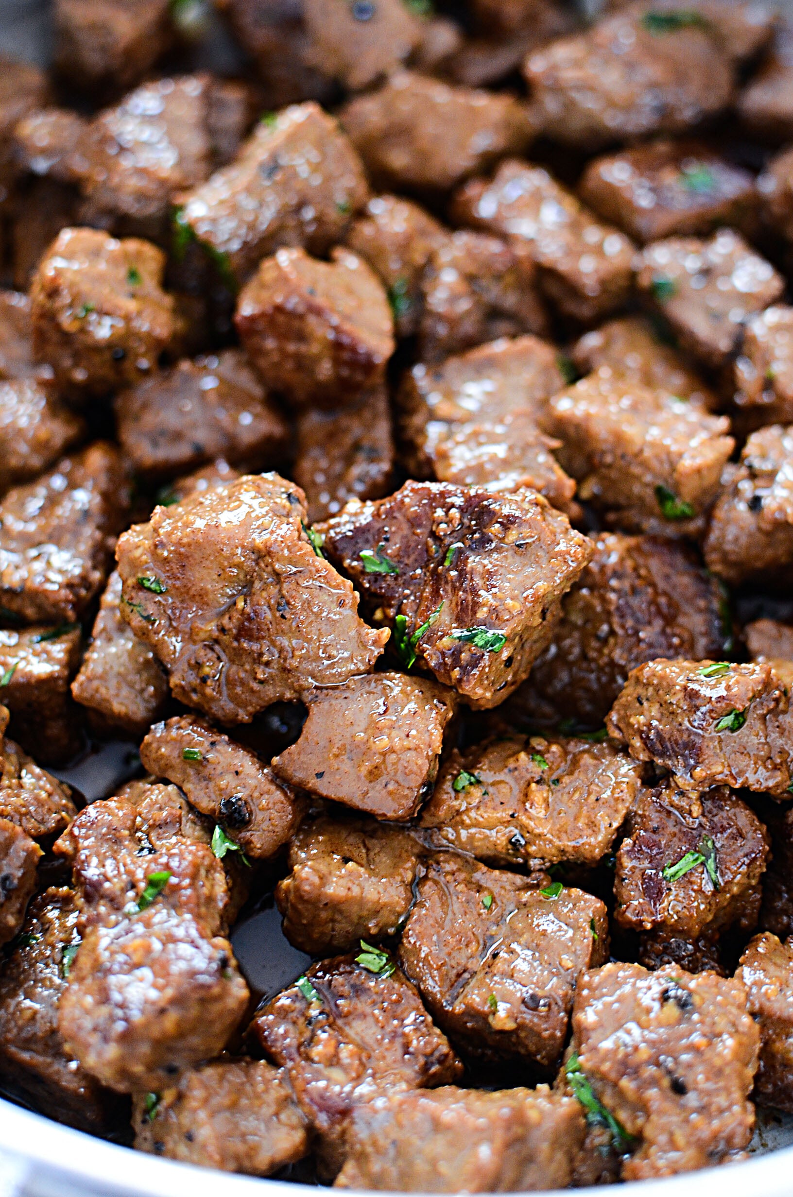Juicy Garlic Butter Steak Bites in a skillet covered in garlic butter