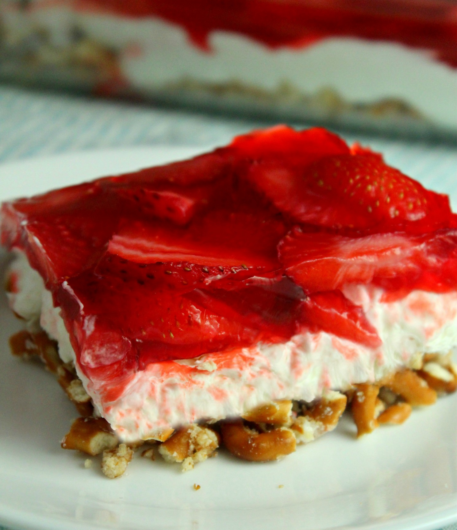 old image of my Strawberry Pretzel Salad on a white playe on a white table