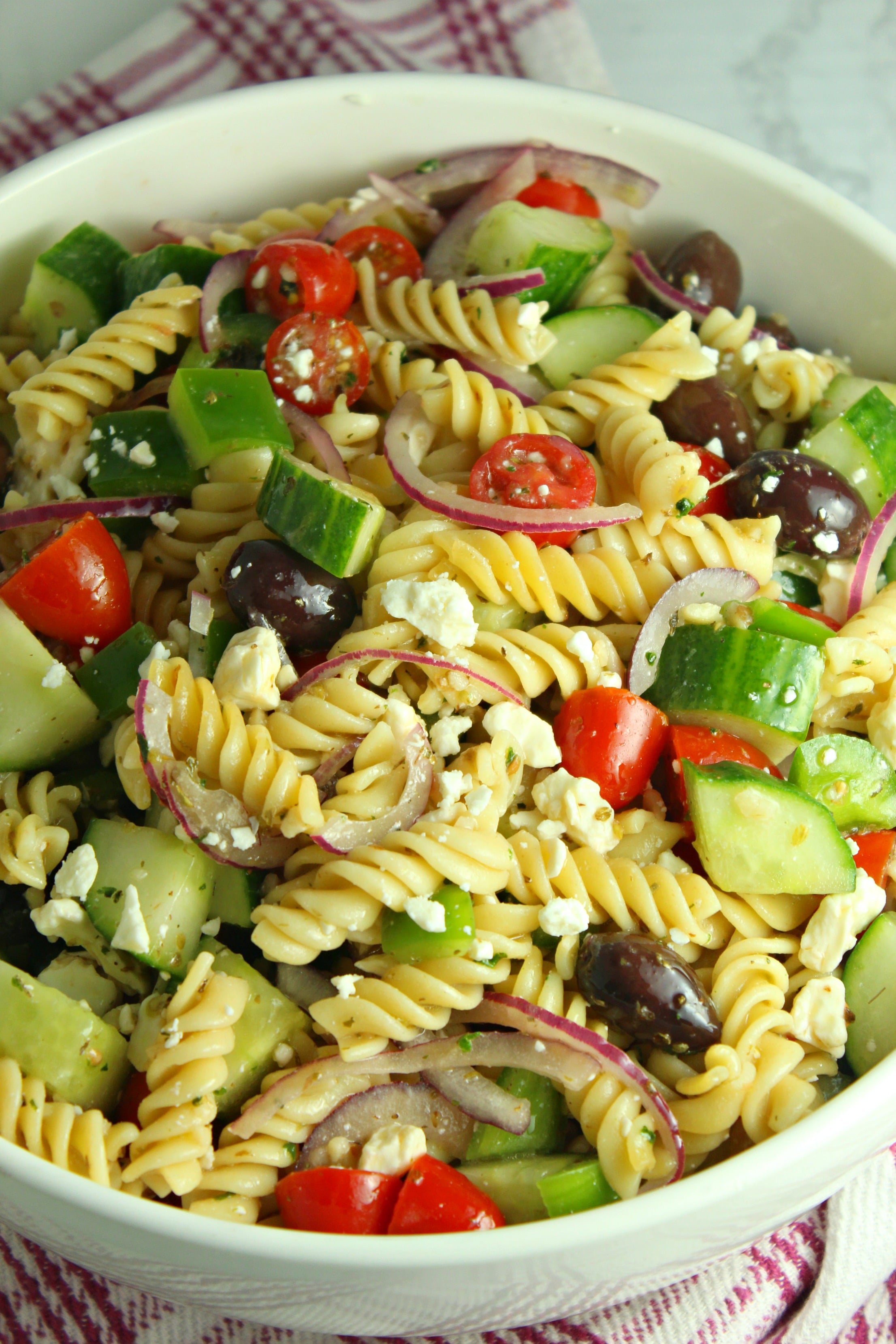 Greek Pasta Salad in a pretty white bowl