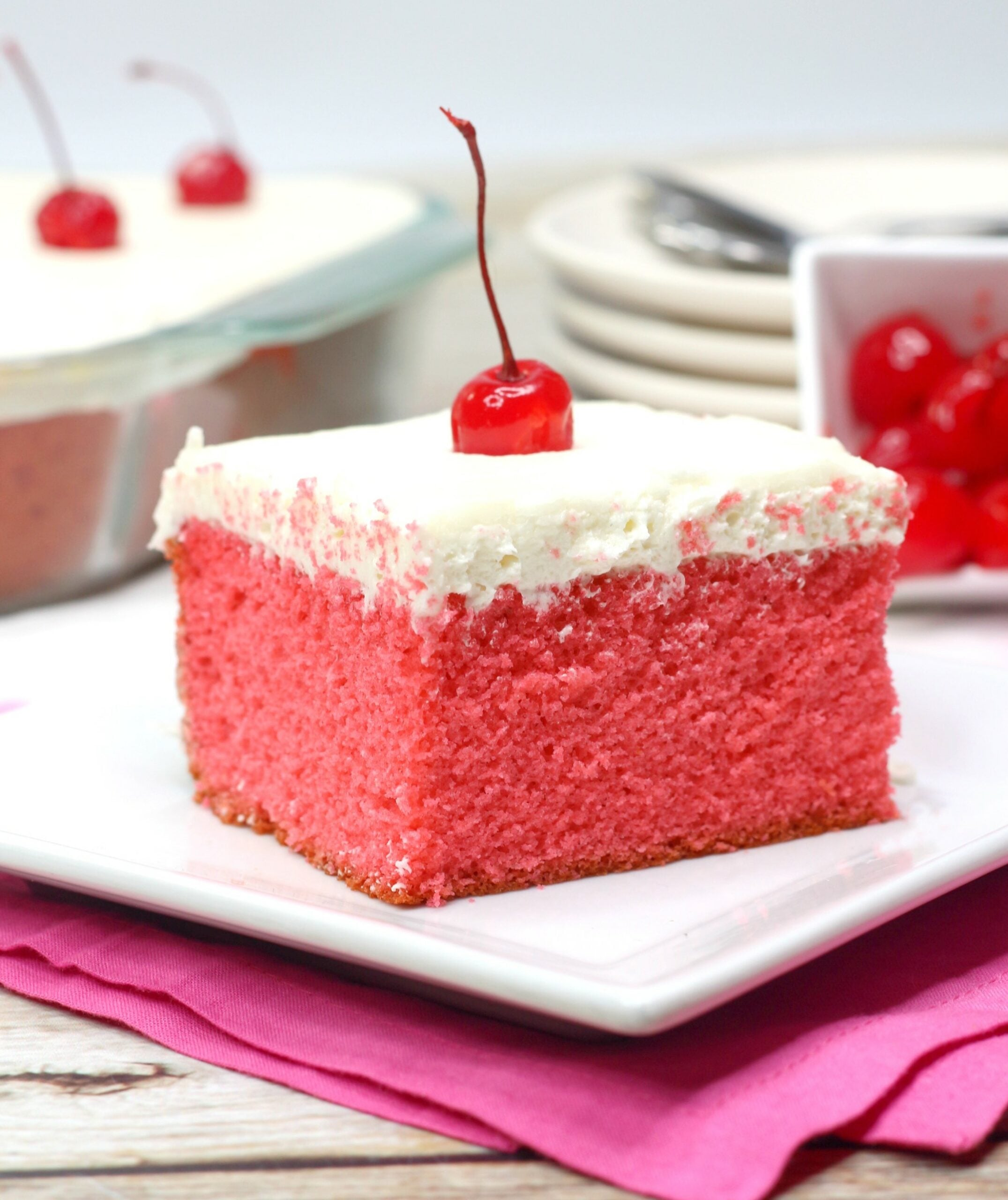 Very Cherry Cake with Vanilla Buttercream on a white plate