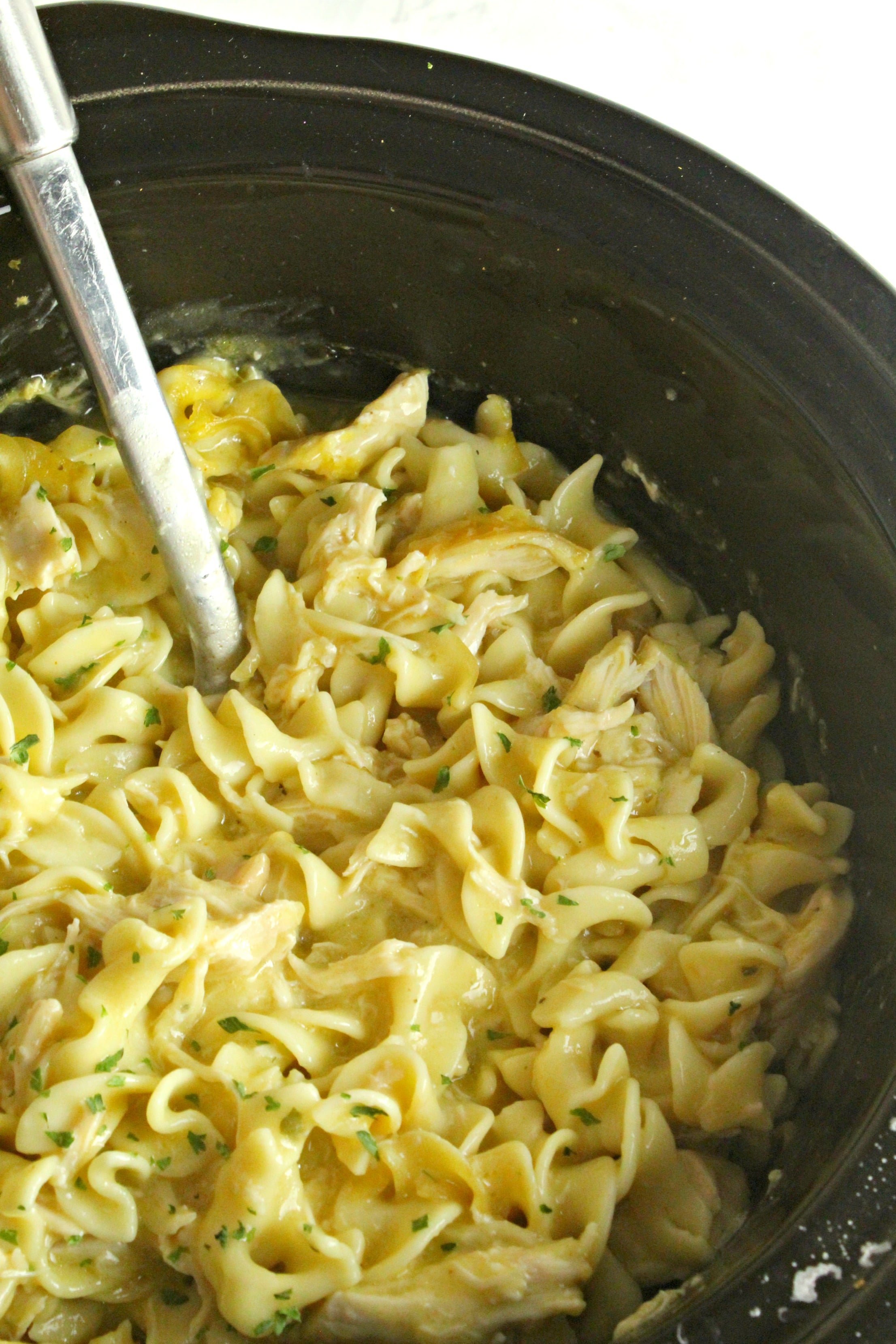 Slow Cooker Chicken and Noodles up close in a slow cooker 