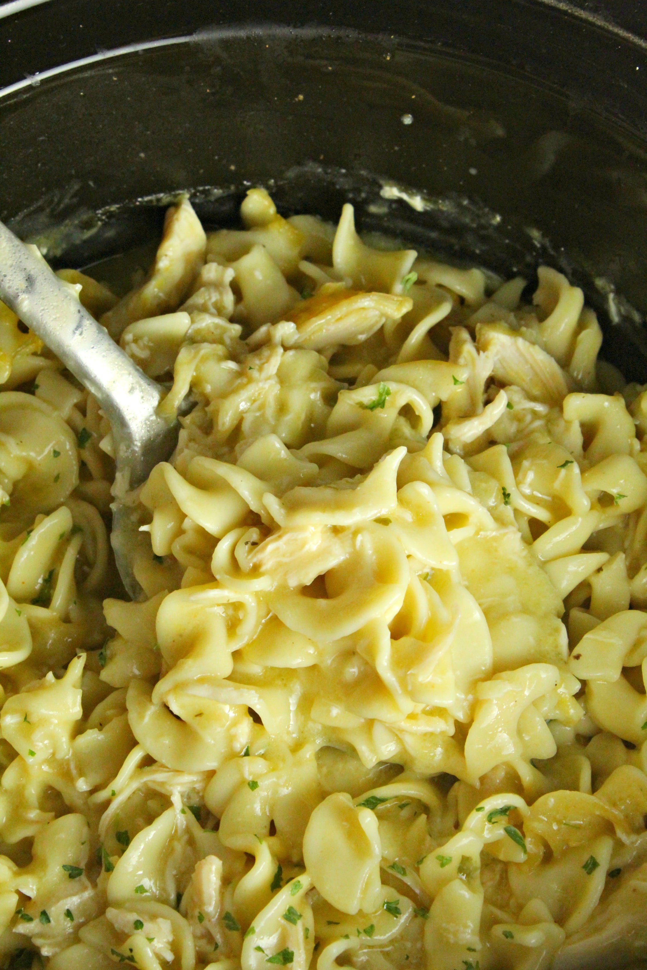 Slow Cooker Chicken and Noodles up close in a slow cooker 