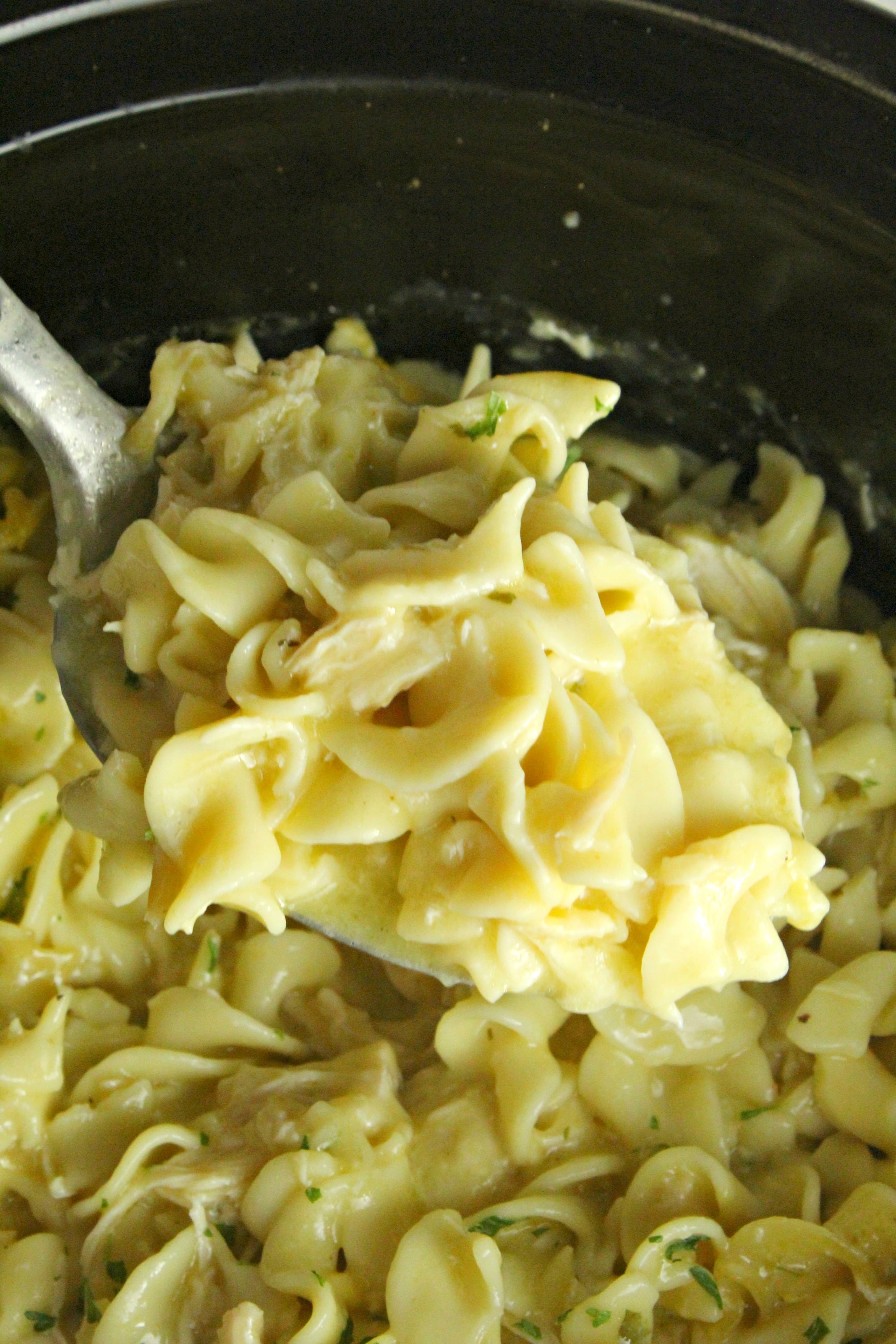 Slow Cooker Chicken and Noodles up close in a slow cooker 