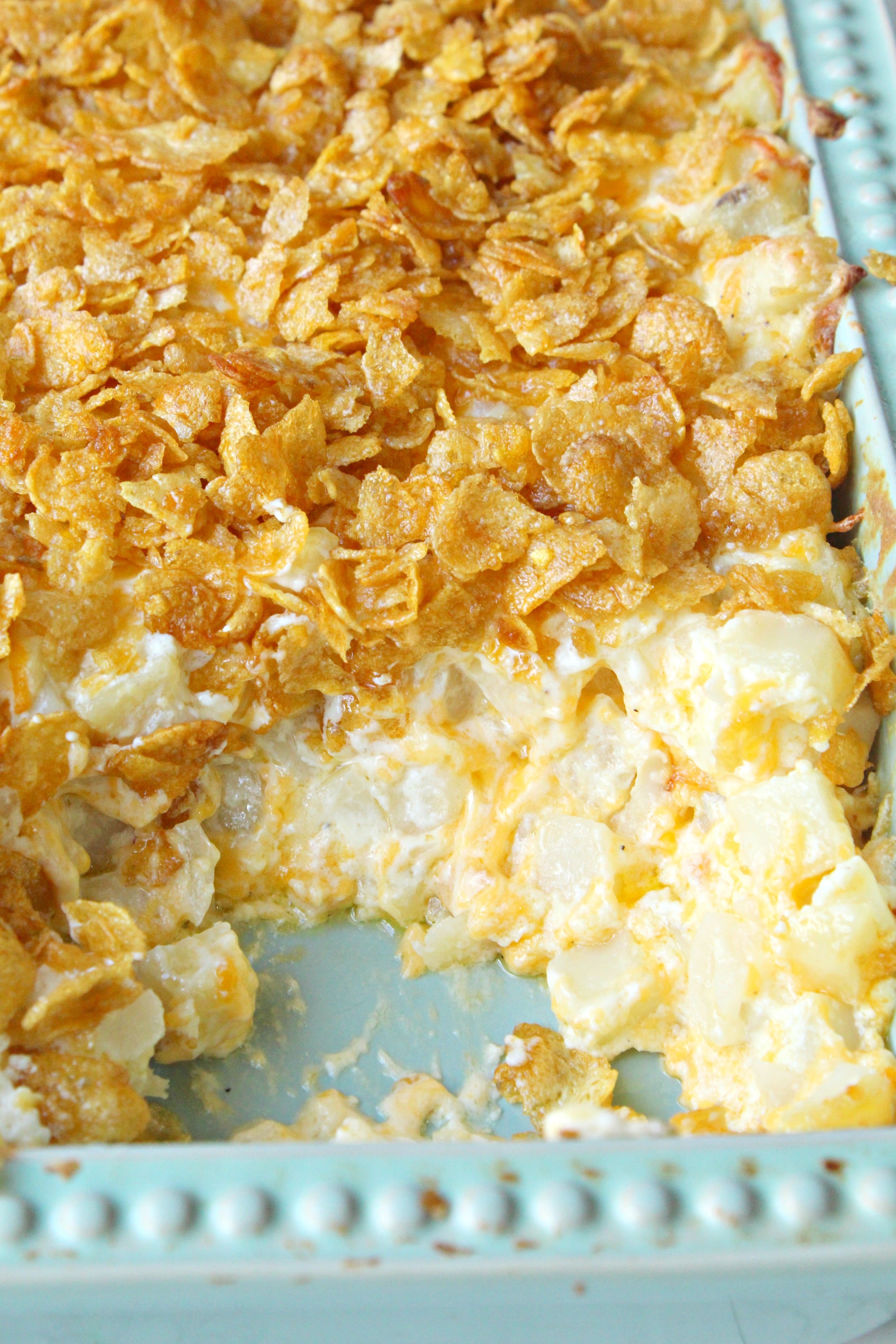 Funeral Potatoes in a green baking pan