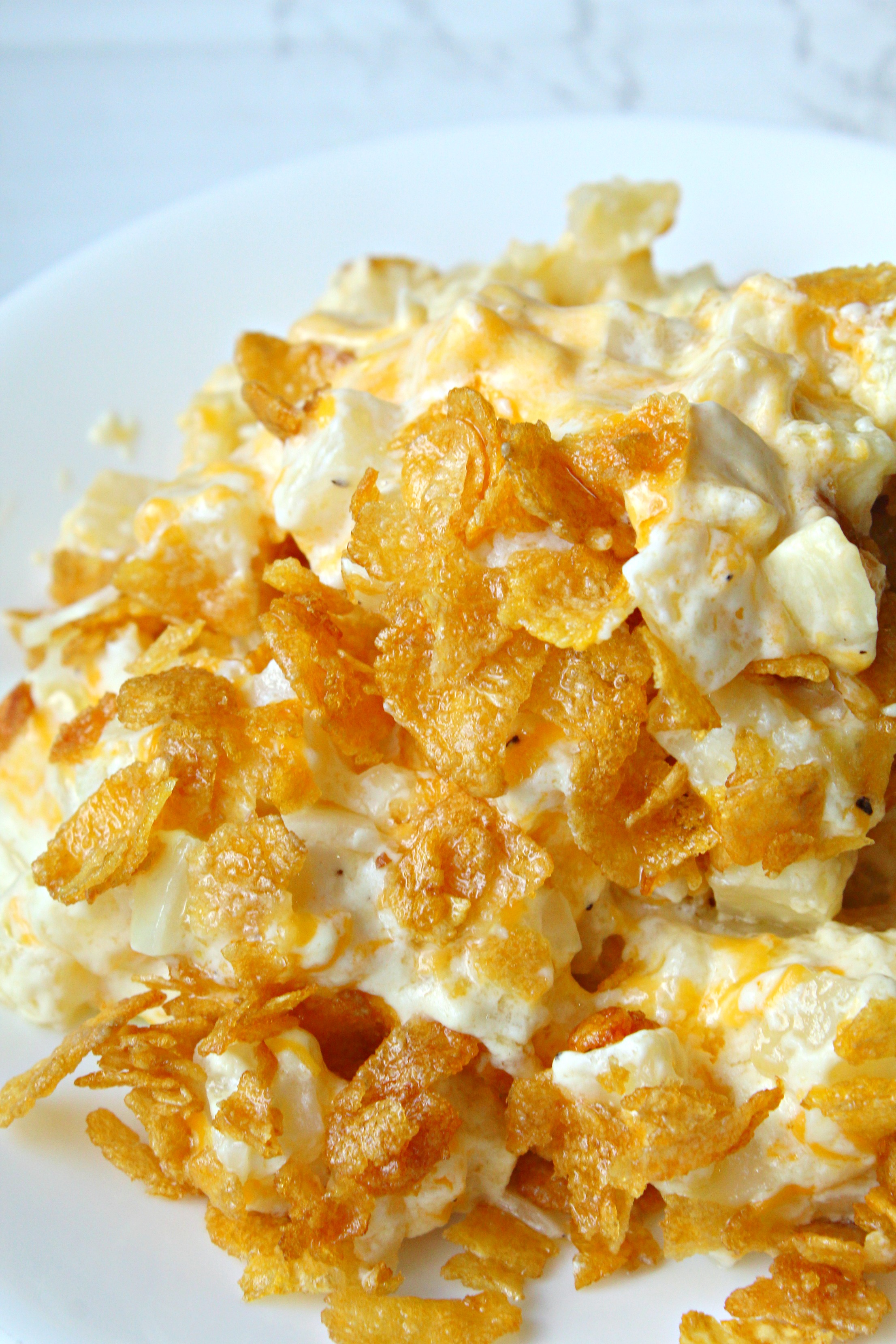 Funeral Potatoes on a plate piled high