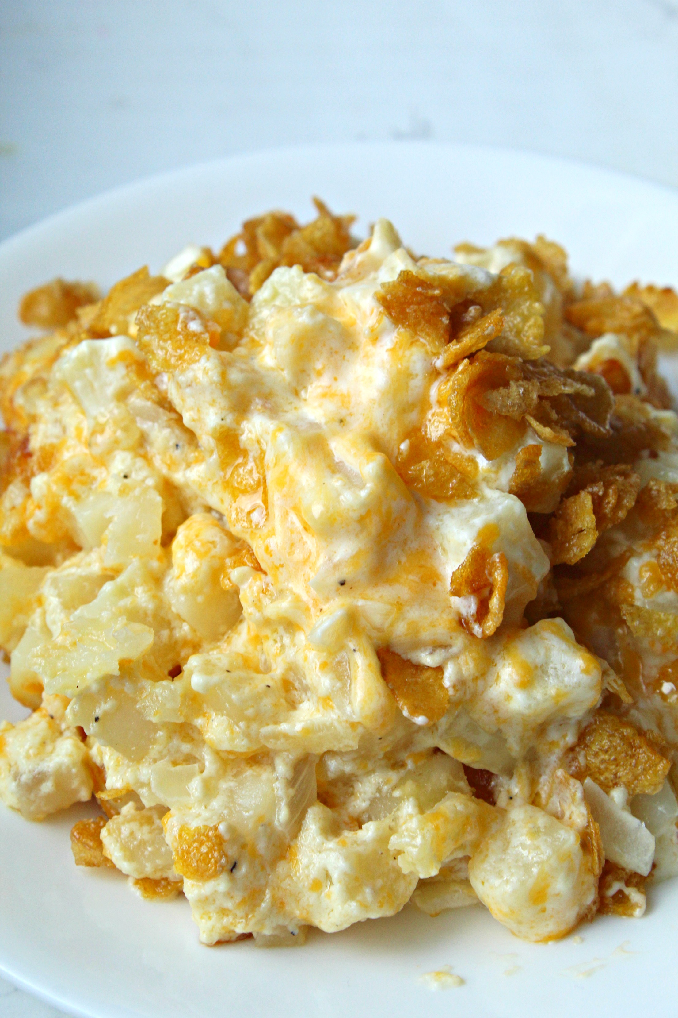 Funeral Potatoes on a white plate