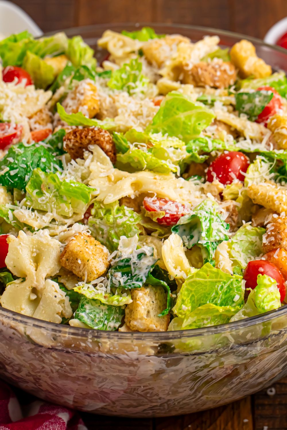 Chicken Caesar Pasta Salad in a bowl on table 