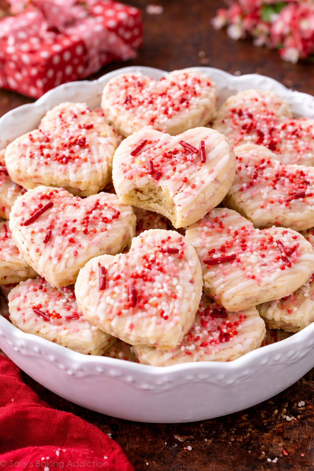Valentine’s Day Shortbread Cookie Bites in a big pretty bowl with a bite missing from one 