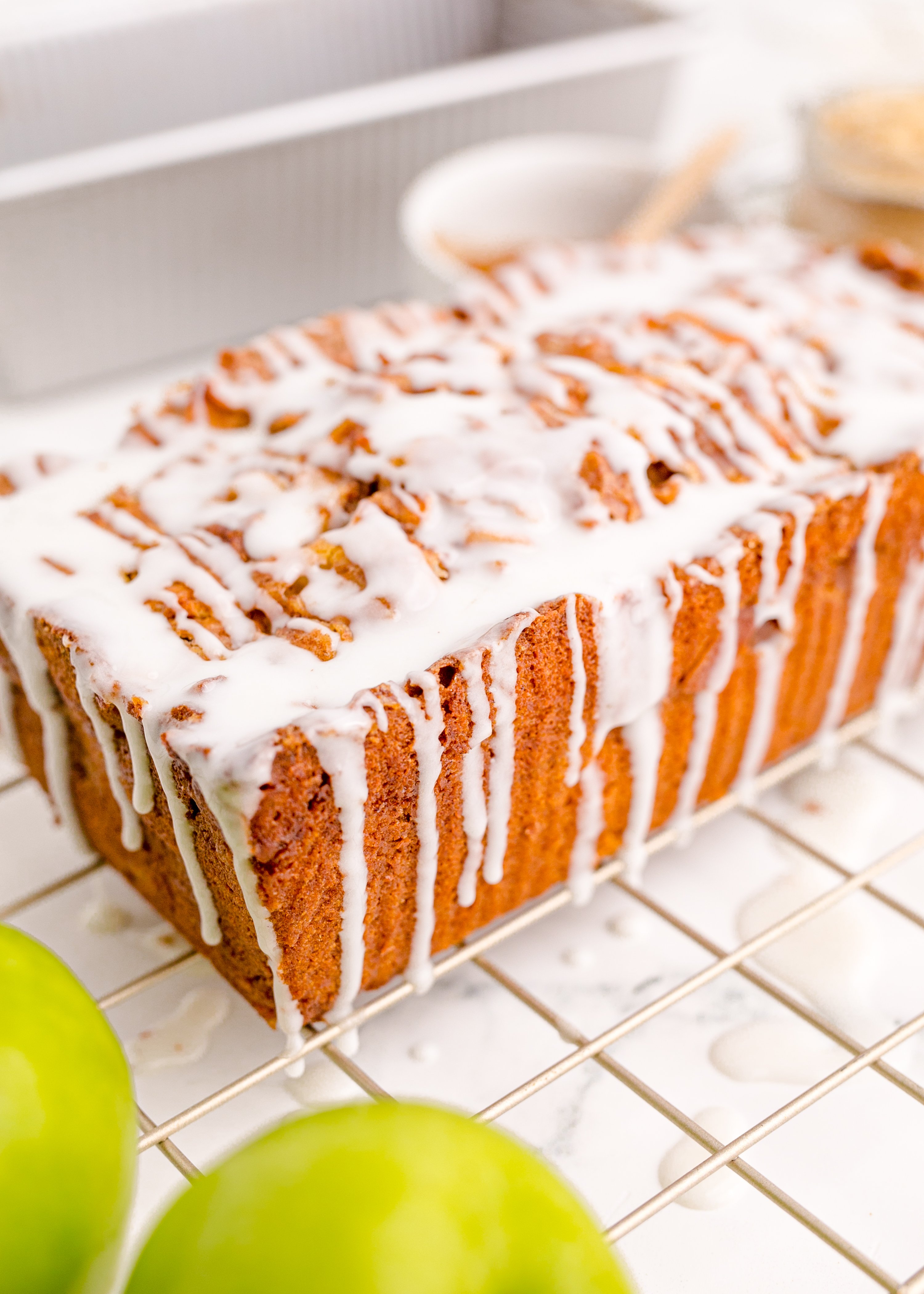 Apple Bread loaf covered in icing dripping