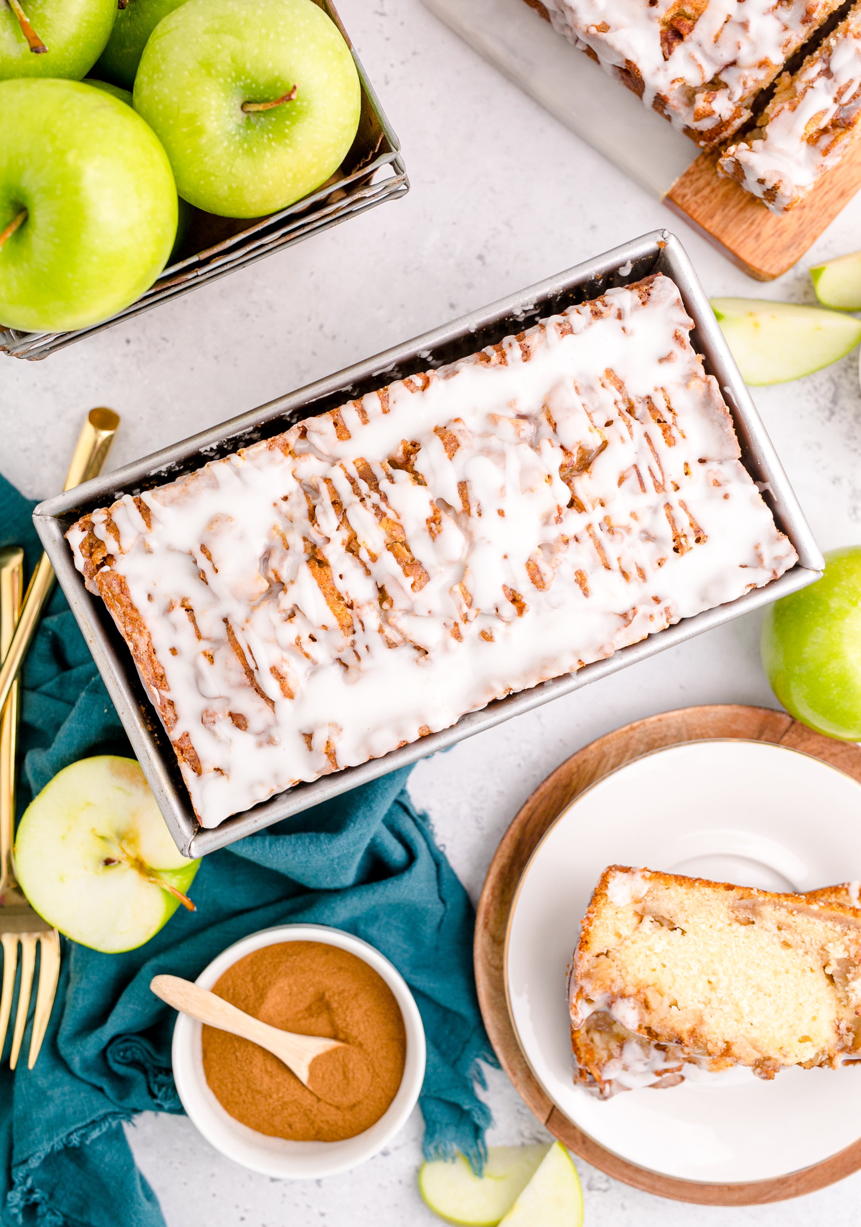 Apple Bread with apples and cinnamon in a bowl next to the bread