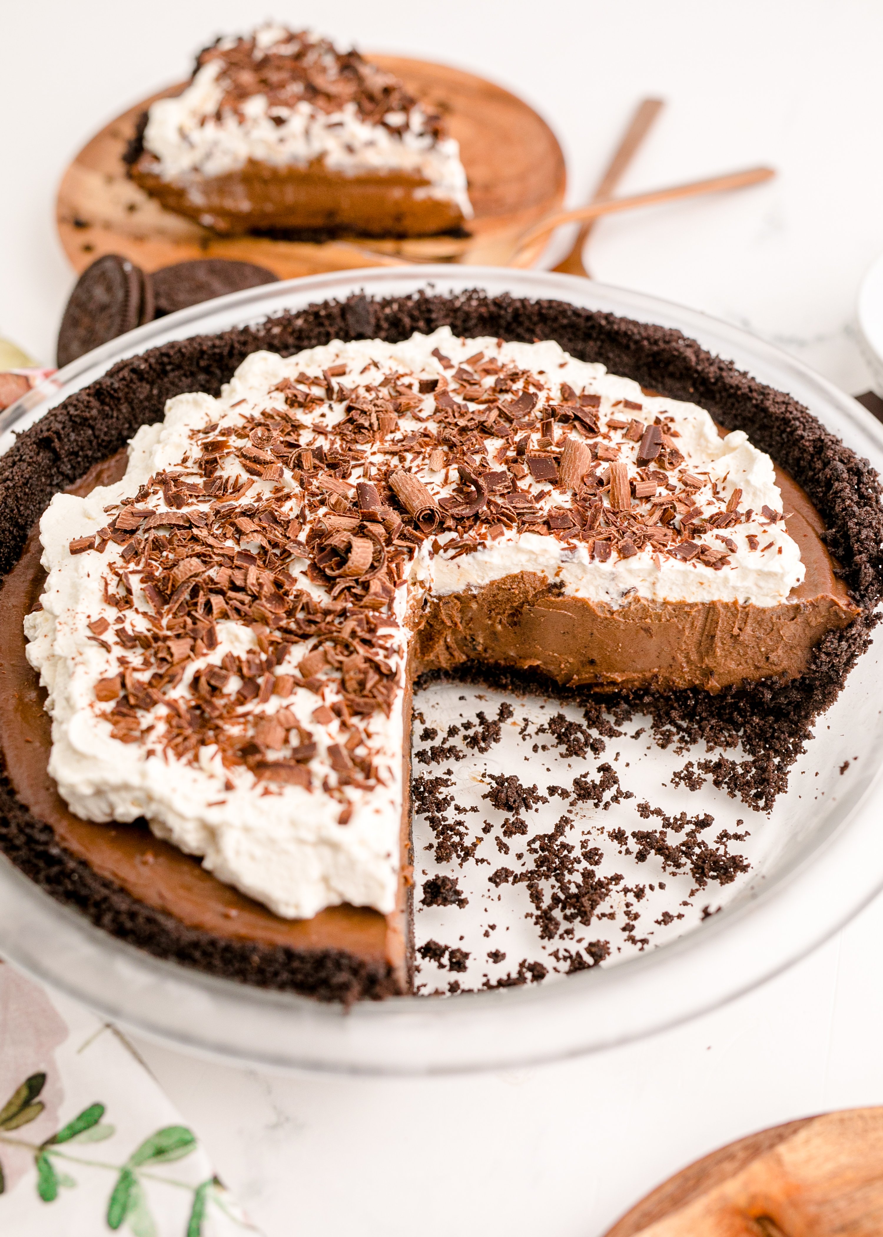 Chocolate Cream Pie topped with whipped cream and chocolate shavings in a pie dish