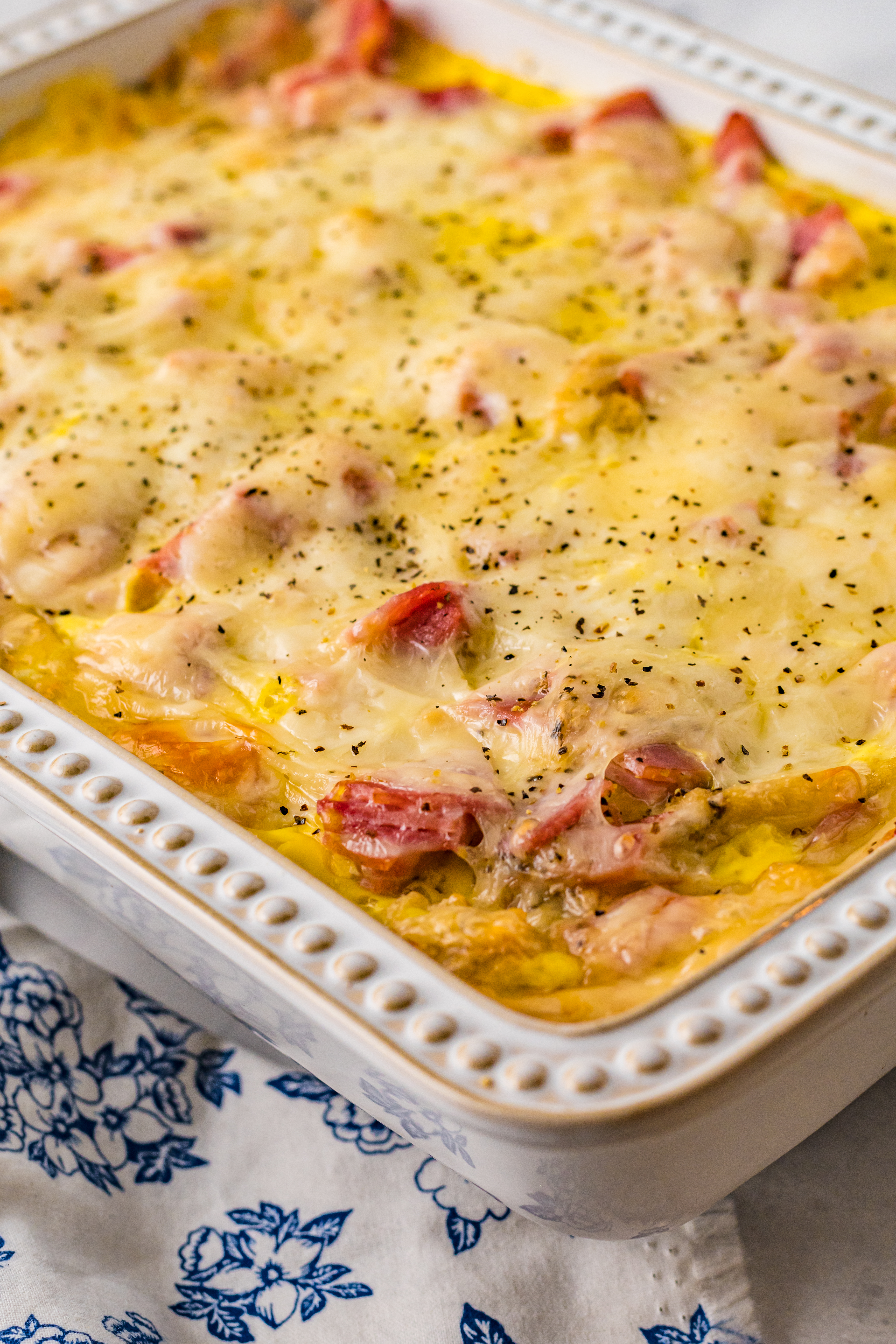 Eggs Benedict in a white casserole dish