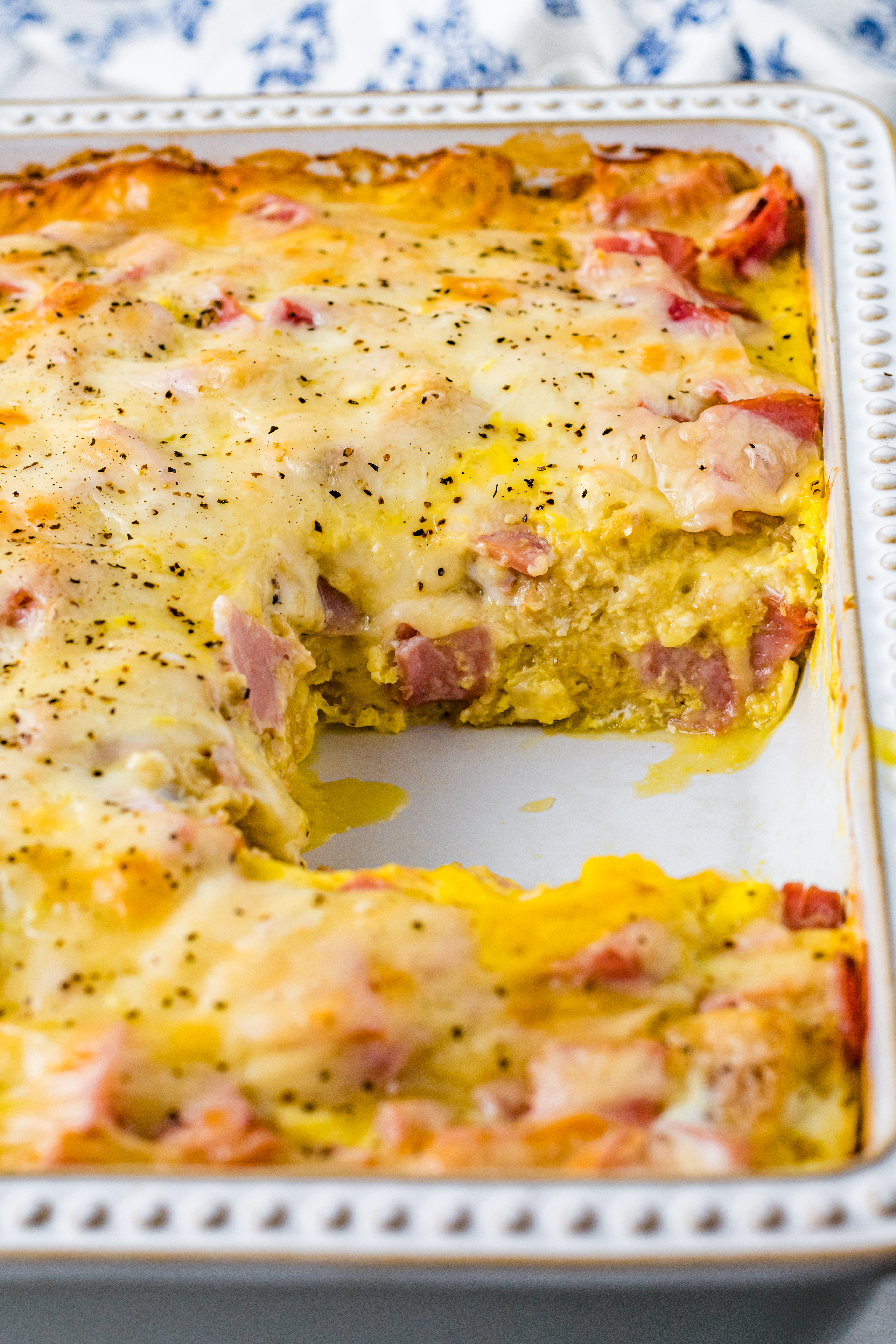 Eggs Benedict in a white casserole dish