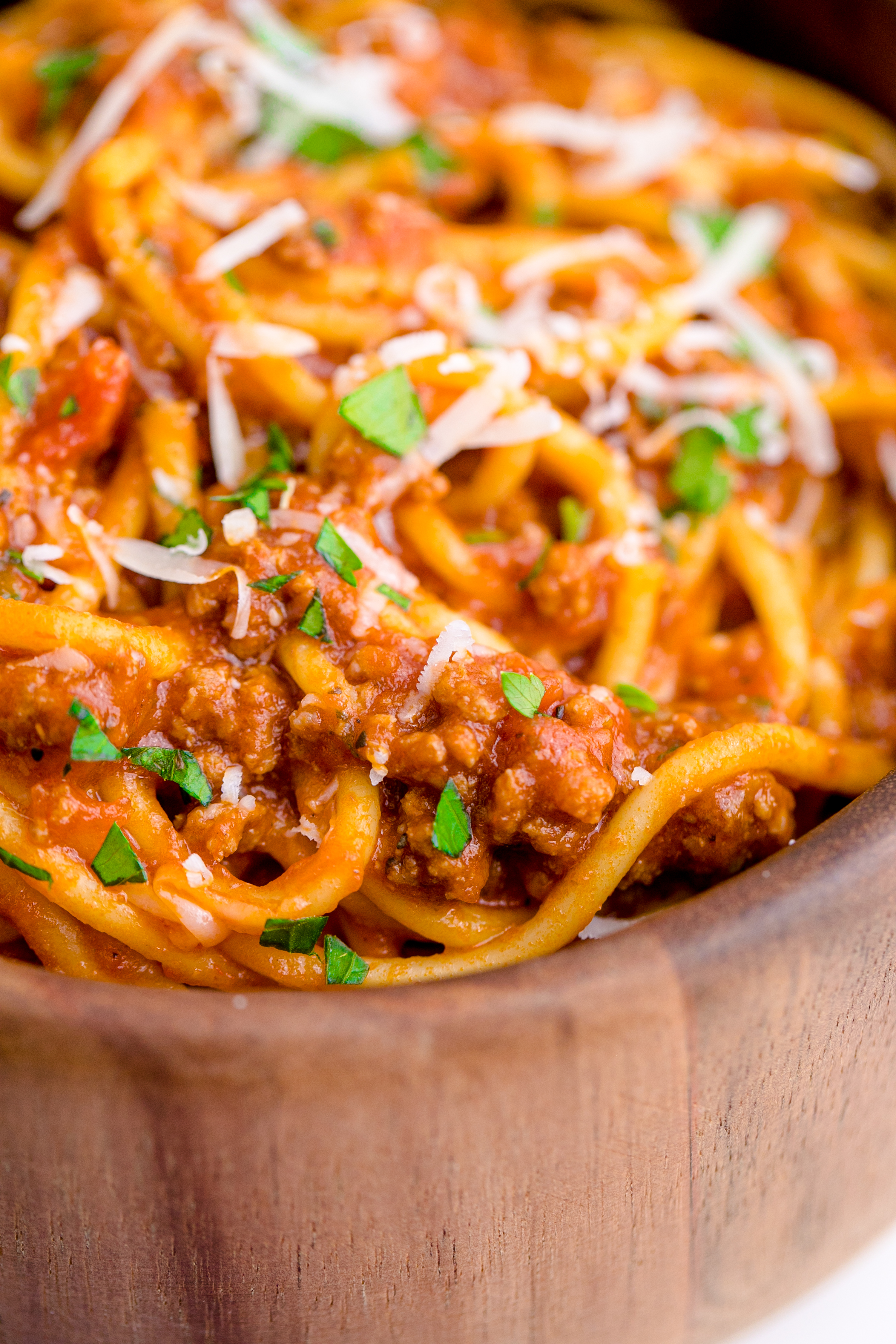 Instant Pot Spaghetti in a wooden bowl close up to see texture