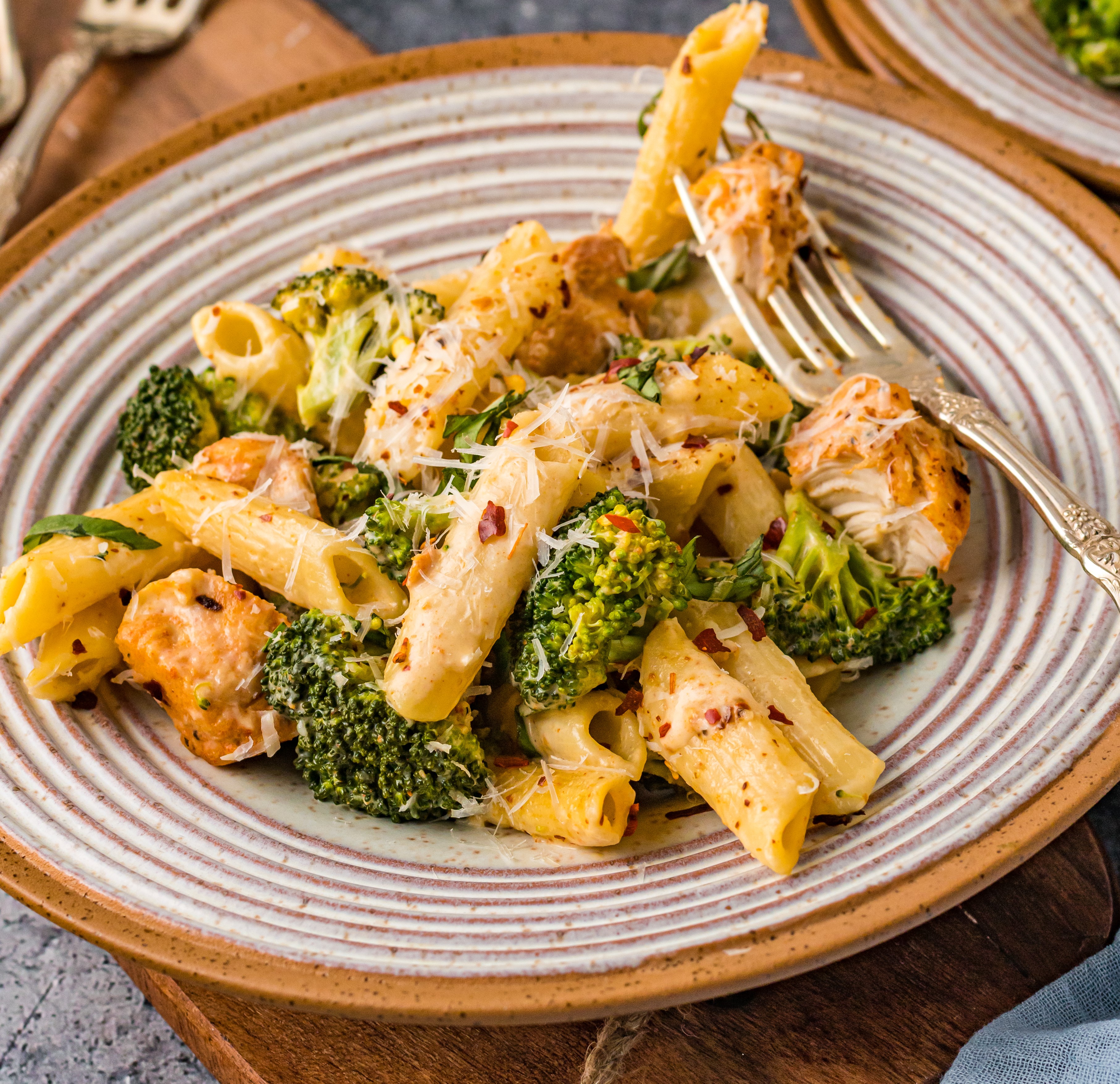 Chicken Pasta on a plate covered in cheese