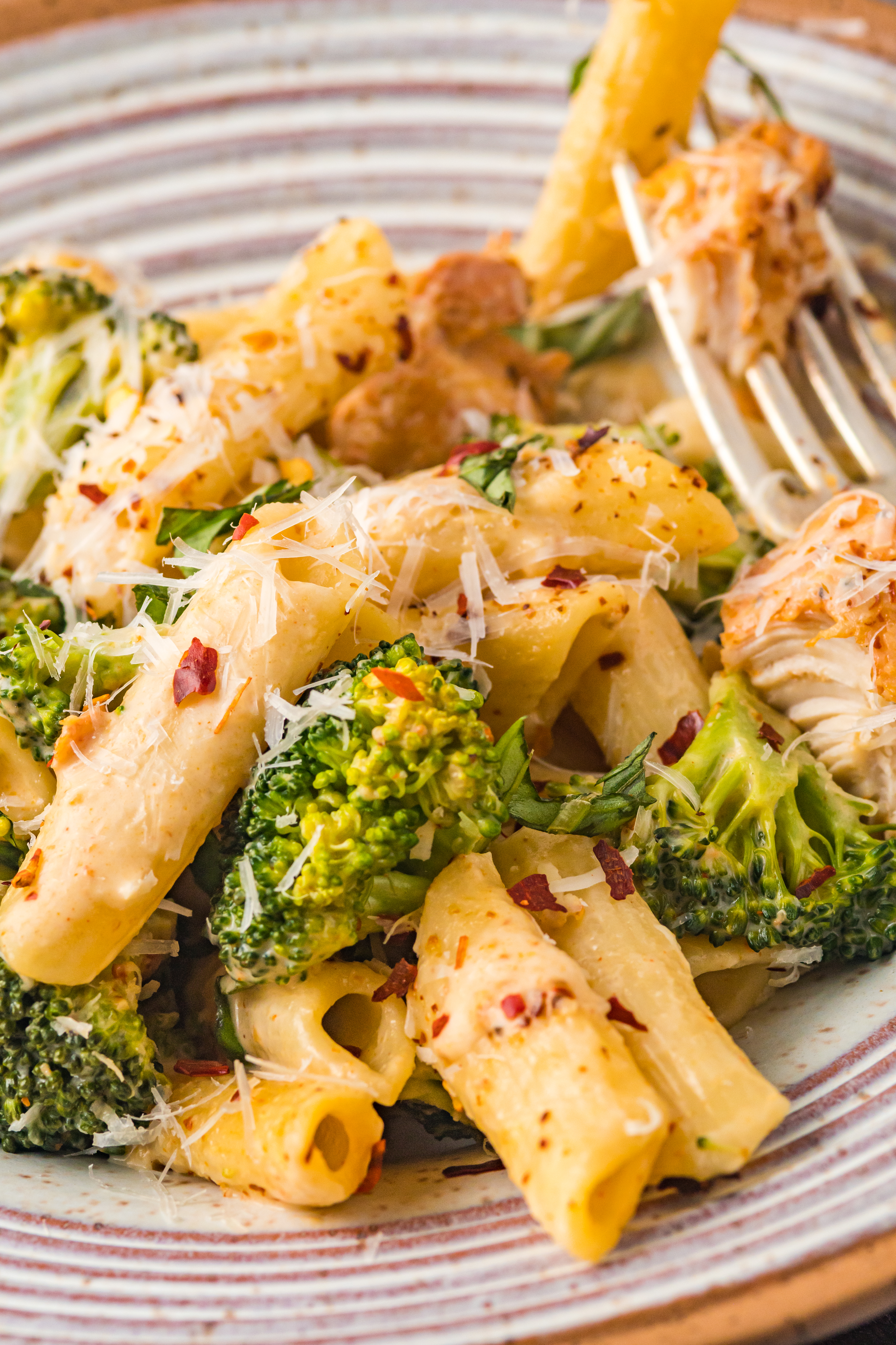 Chicken Pasta on a plate covered in cheese