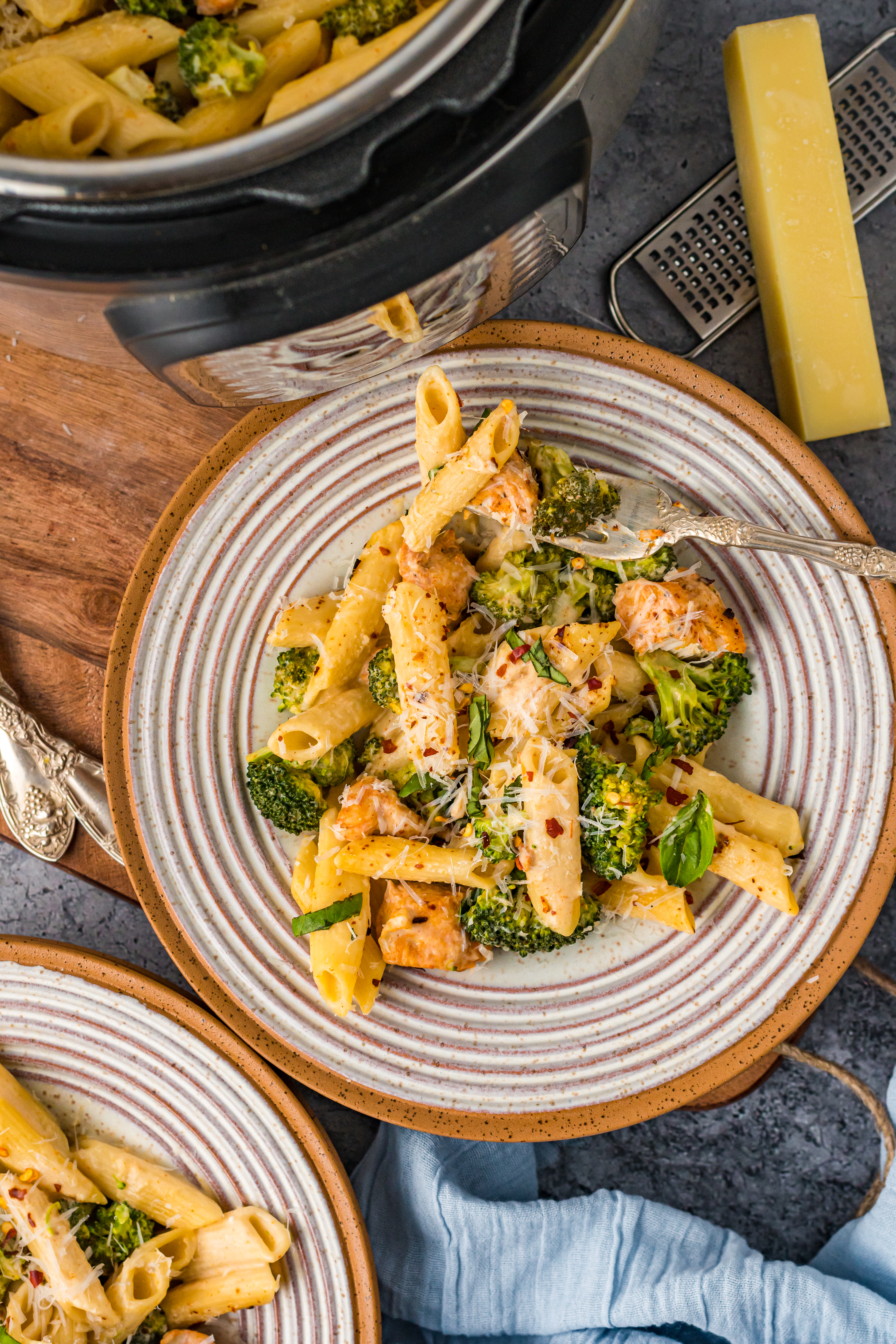 Chicken Pasta on a plate covered in cheese
