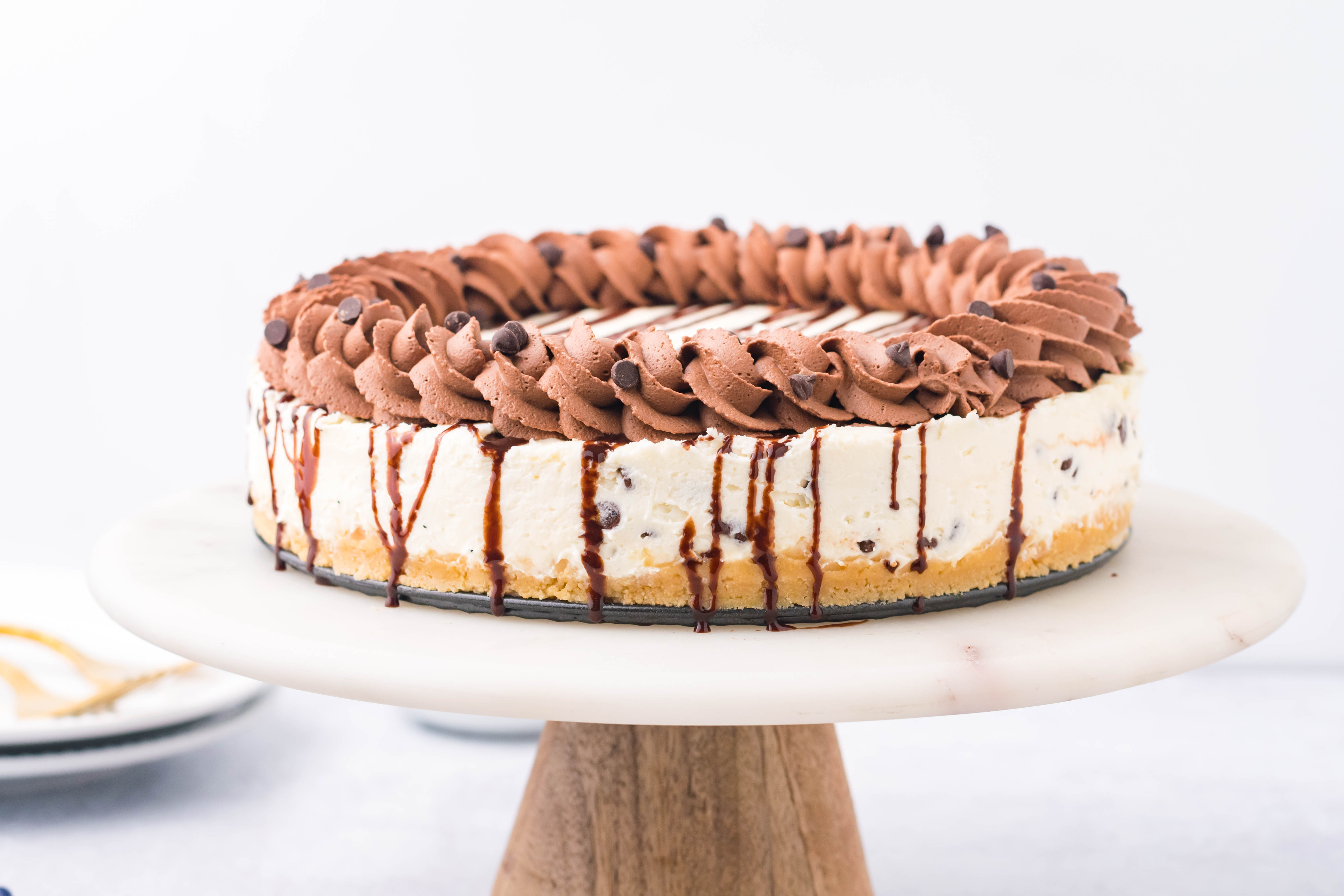 Chocolate Chip Cheesecake on a cake stand