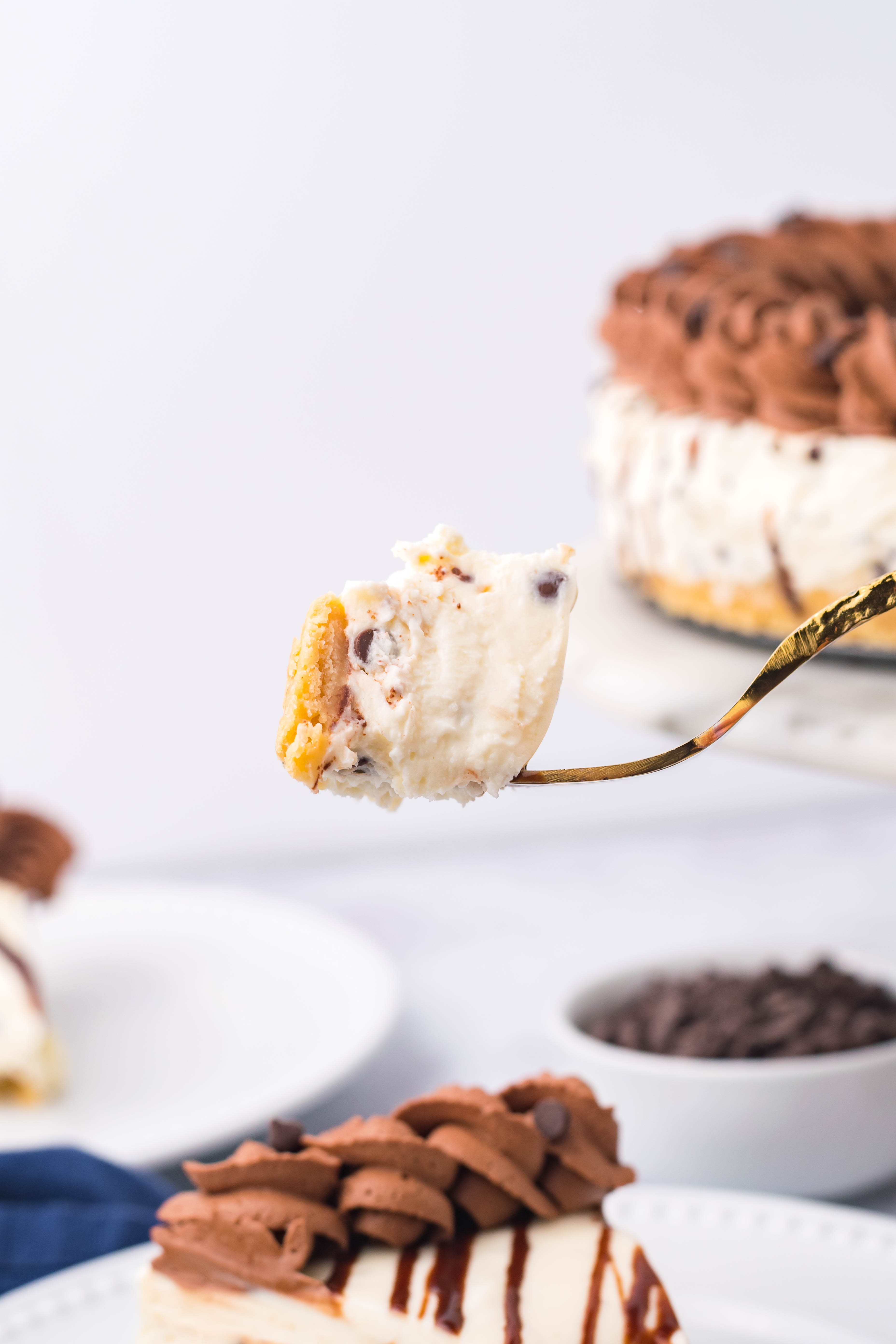 Chocolate Chip Cheesecake bite on a gold fork