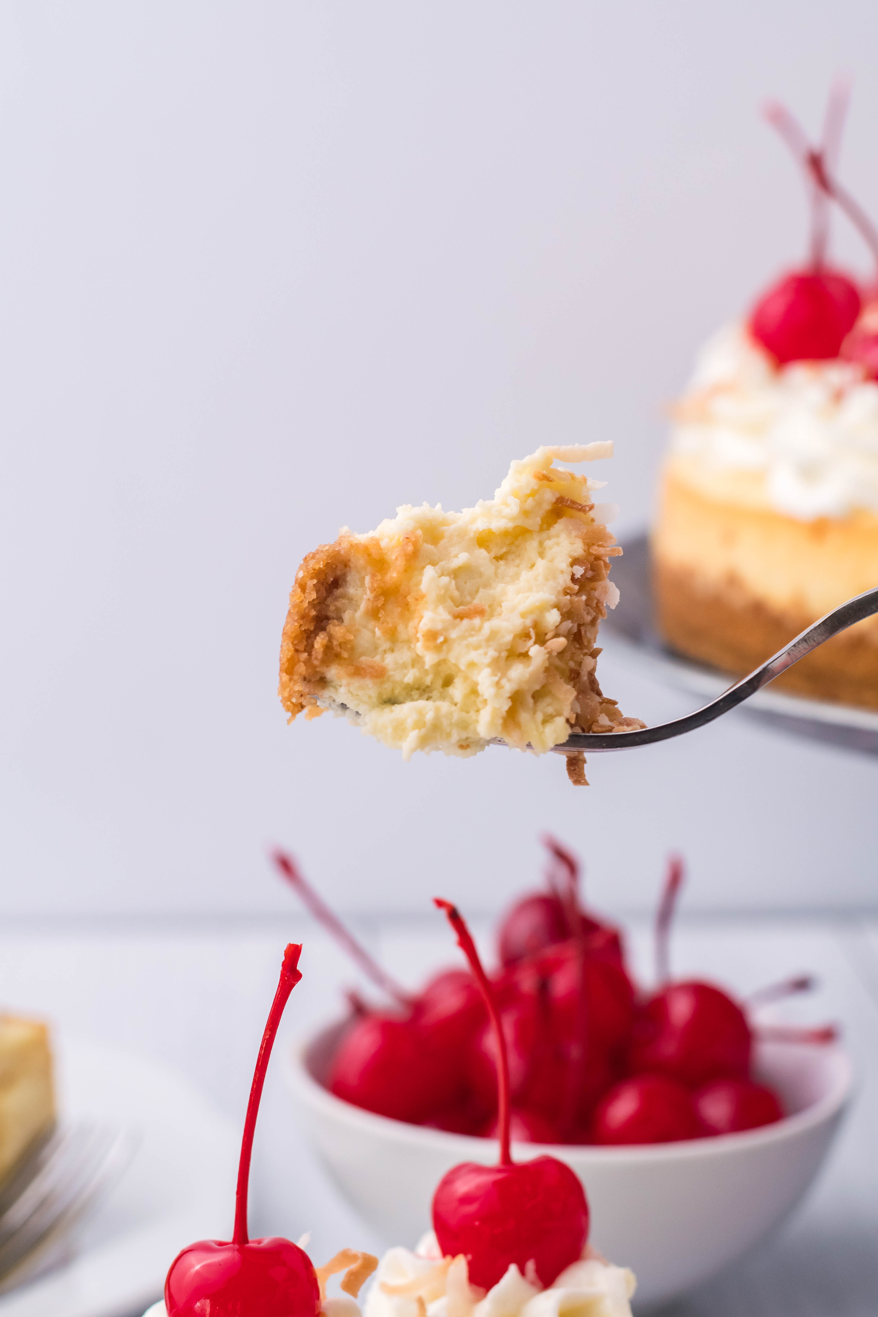 Coconut Cheesecake bite on a fork