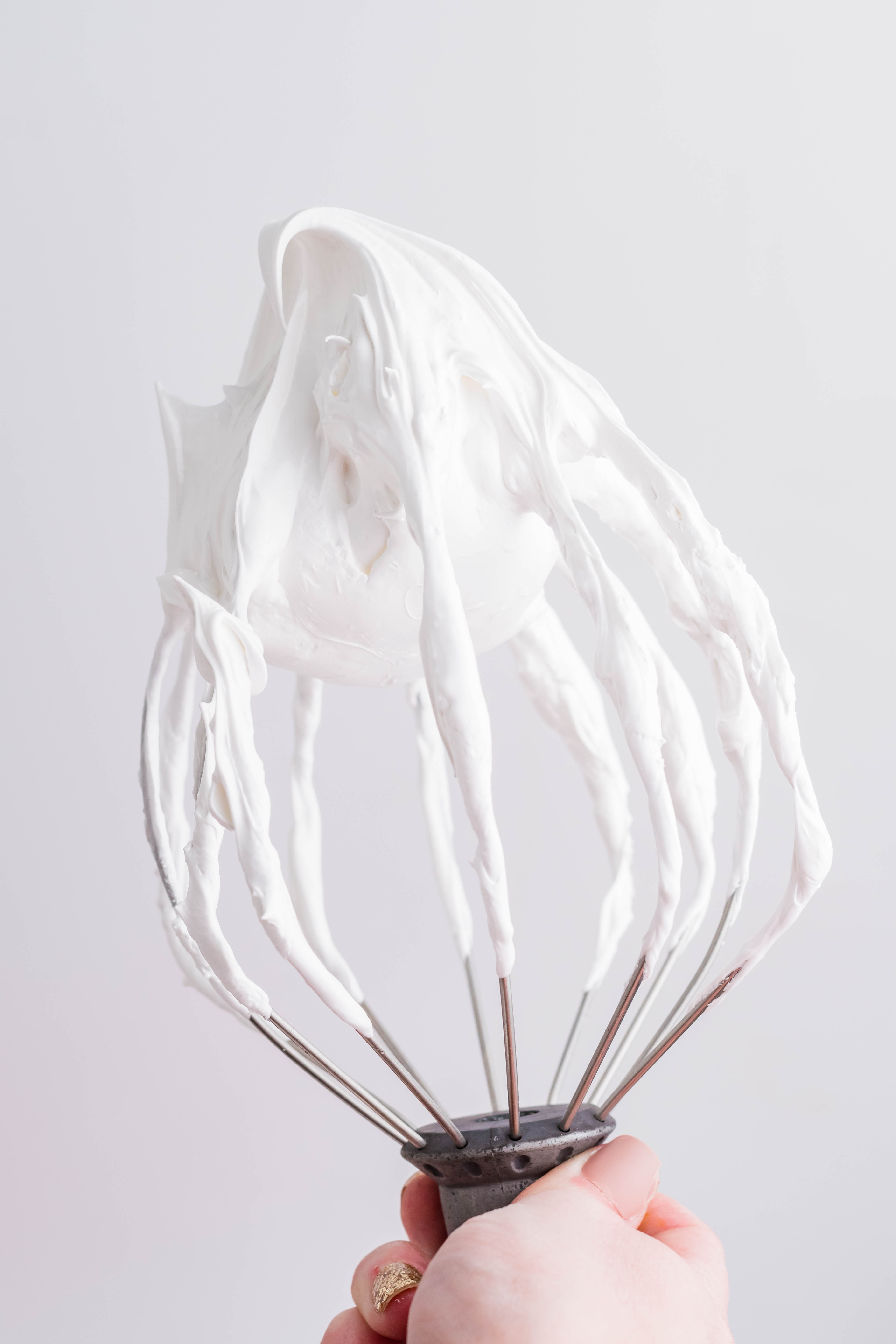marshmallow frosting on a whisk