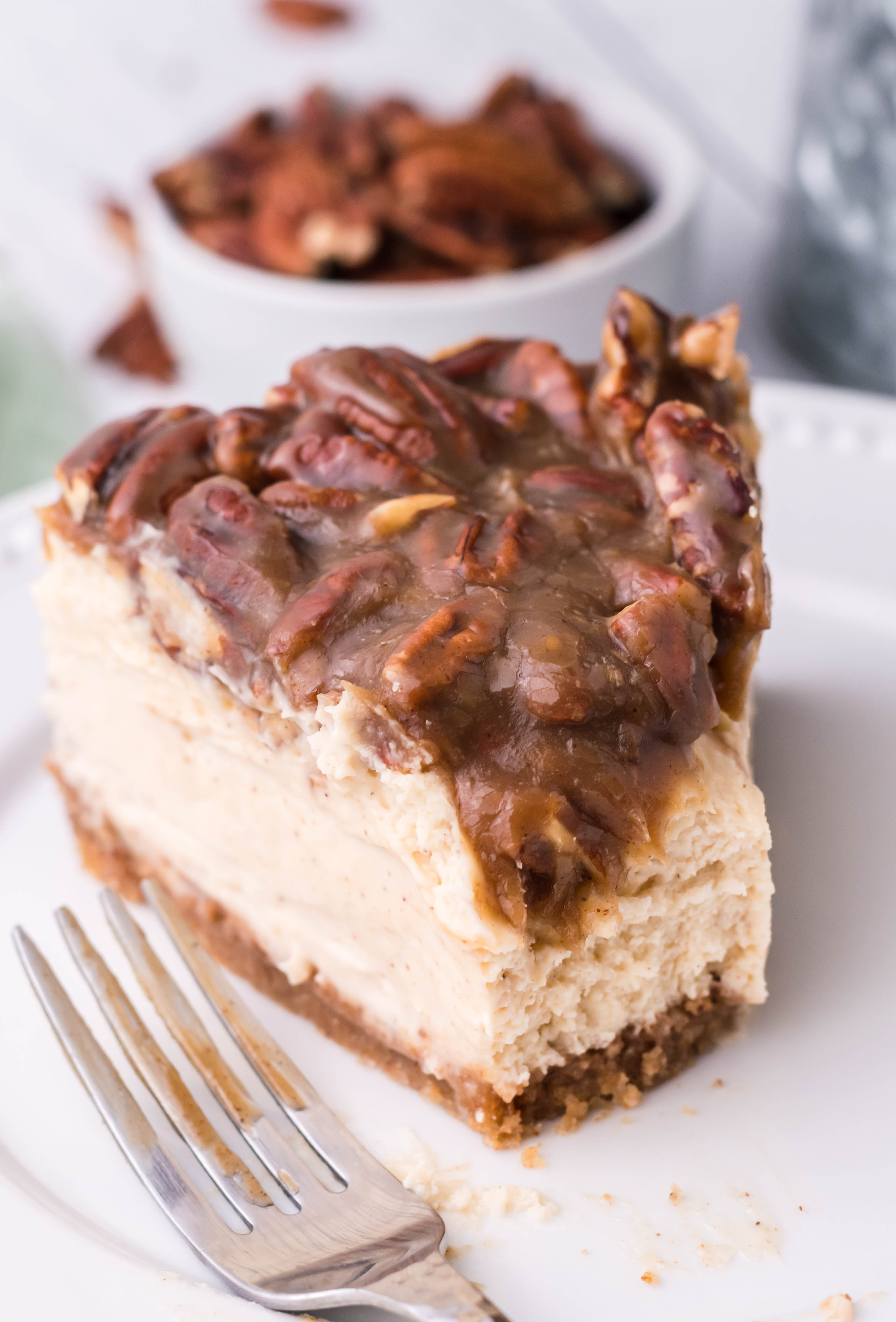 pecan pie Cheesecake slice on a white plate
