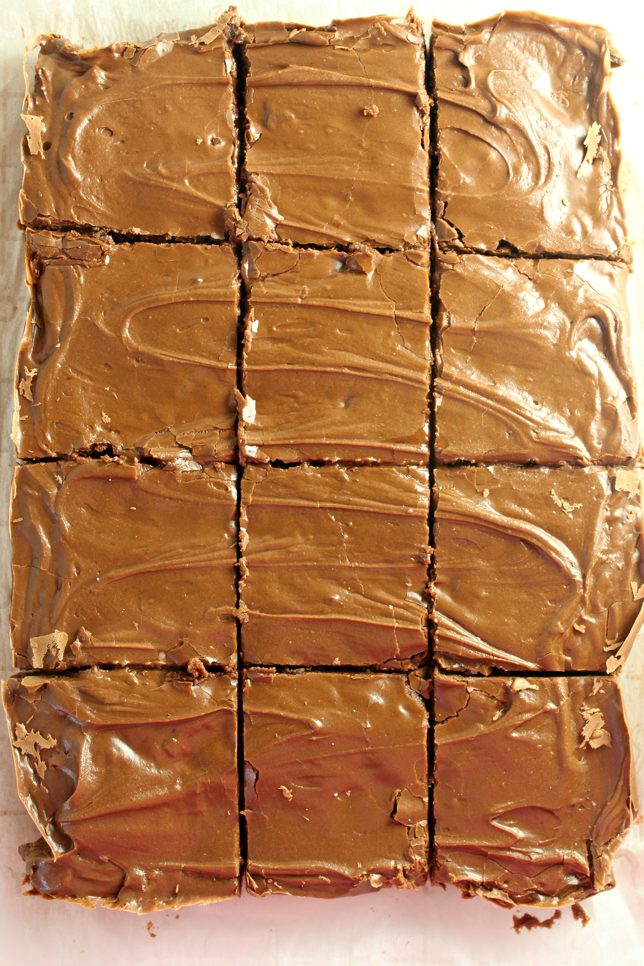 Homemade chocolate frosted lunch lady Brownies in a baking sheet cut in squares