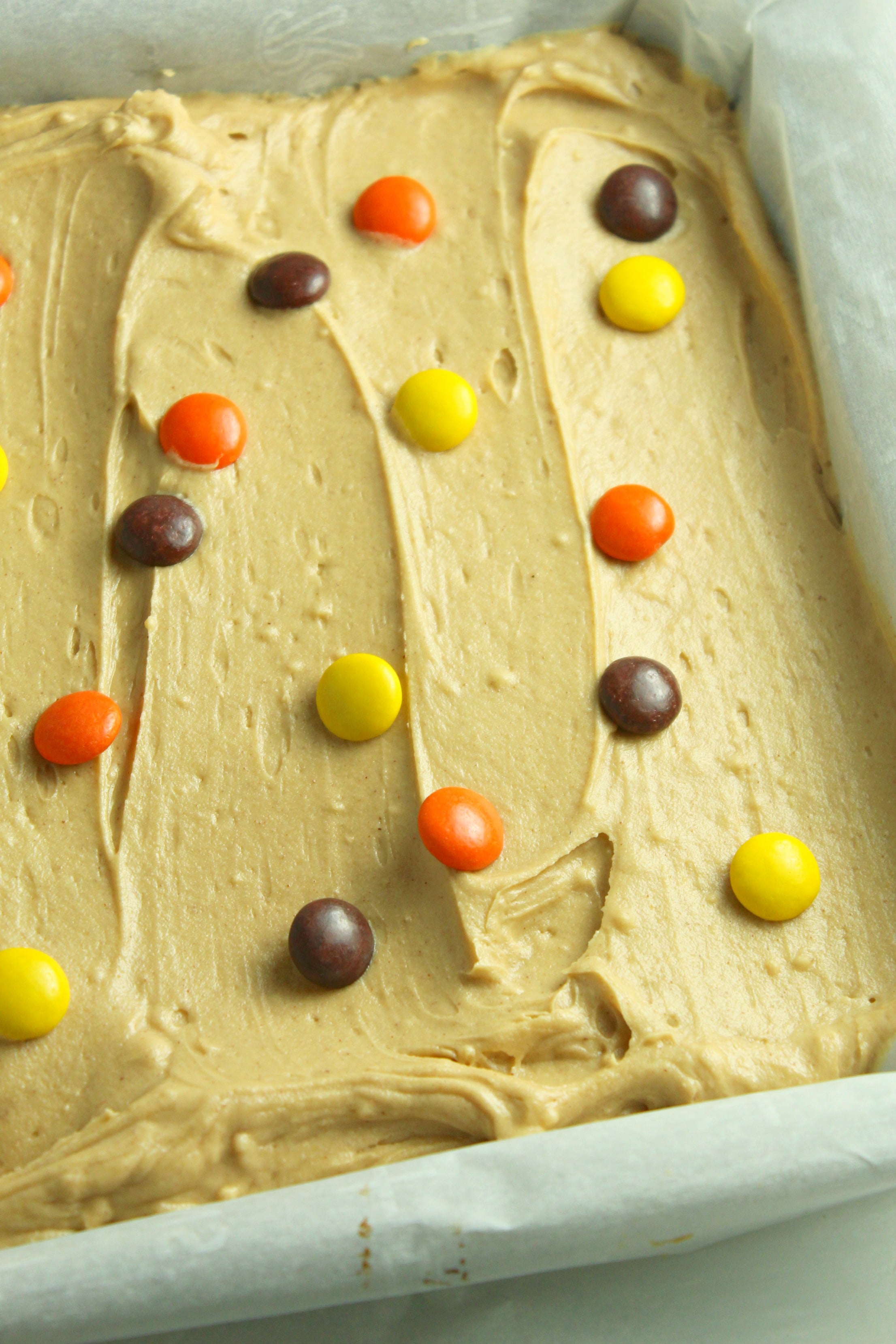 Peanut Butter Bars topped with peanut butter frosting & reeses pieces