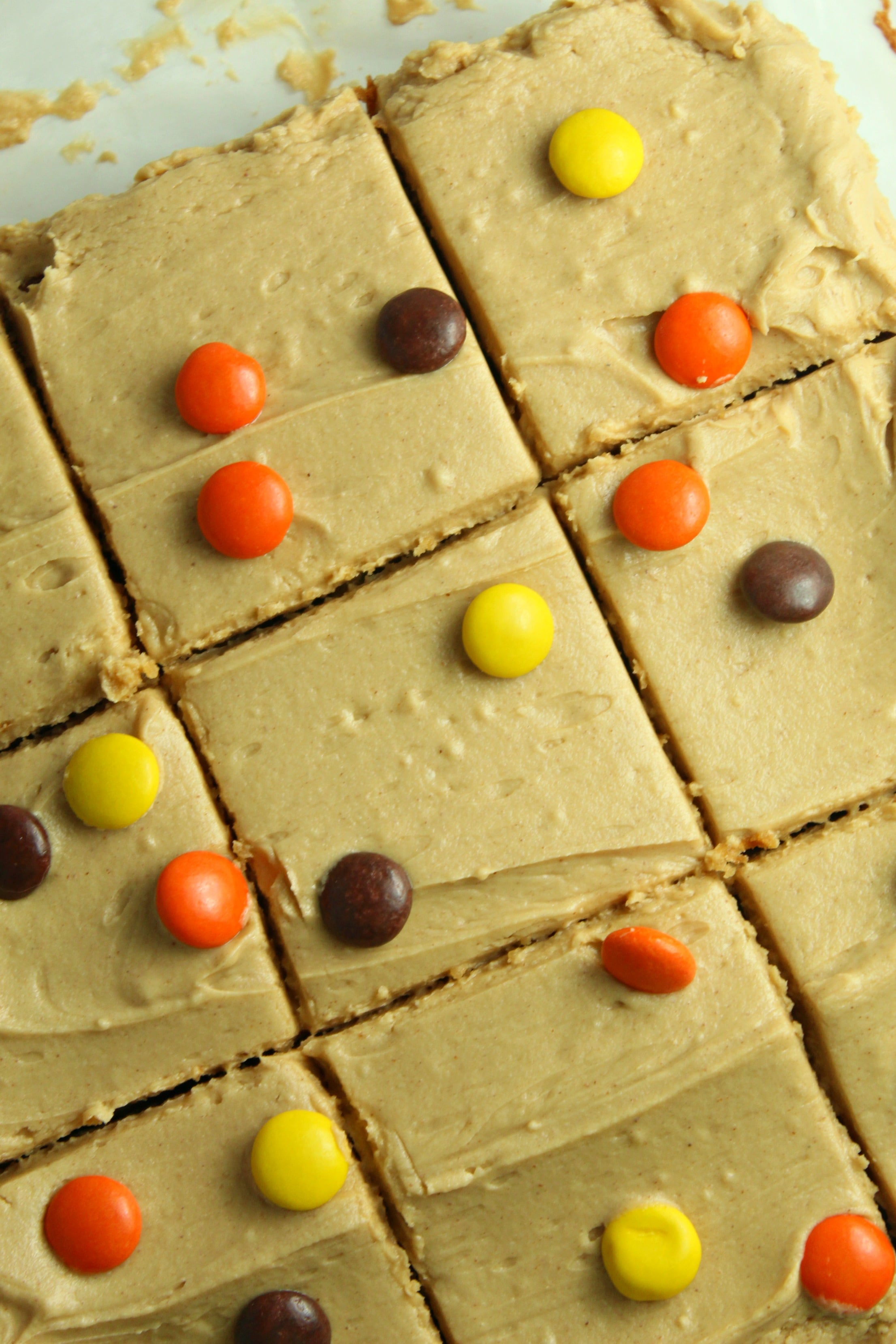 Peanut Butter Bars topped with peanut butter frosting & reeses pieces overhead
