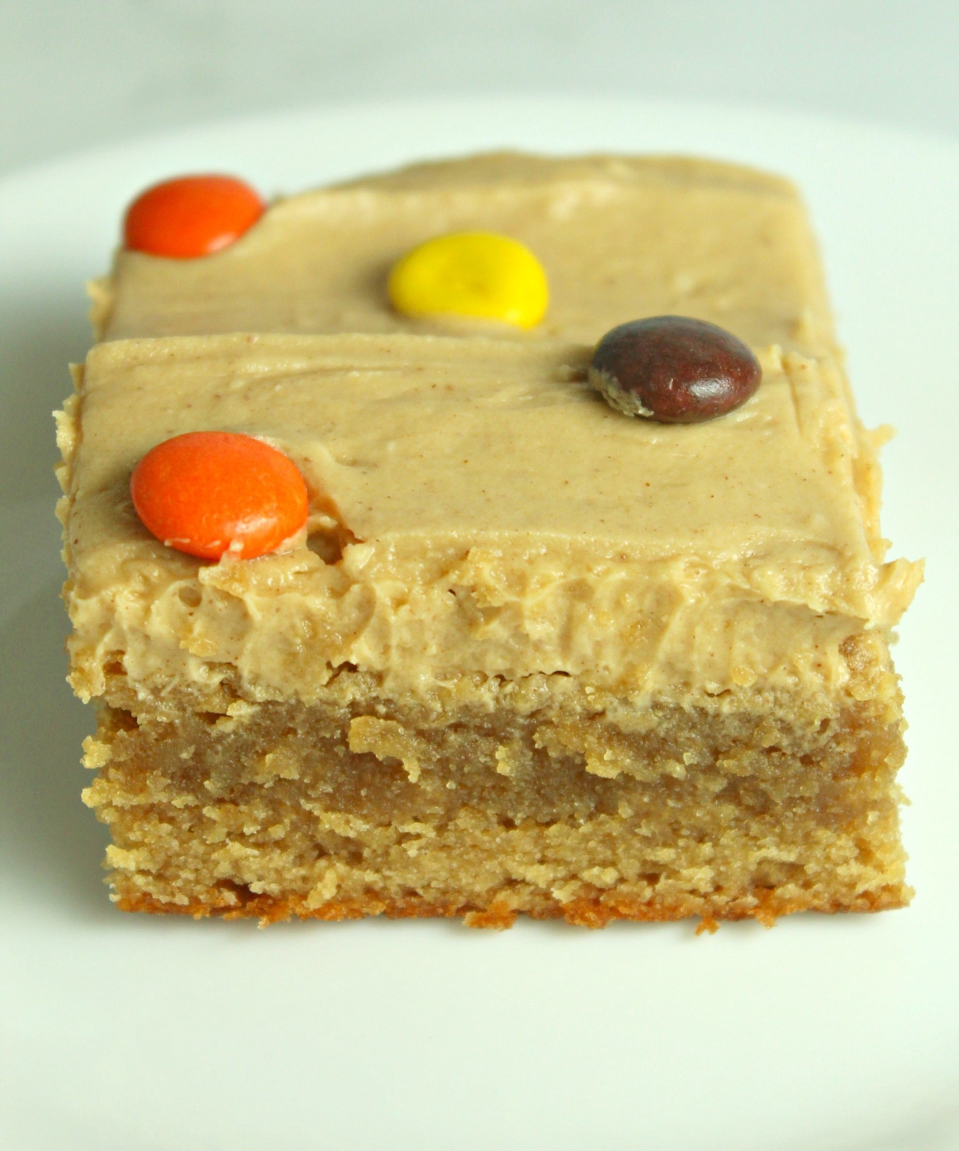 Peanut Butter Bars topped with peanut butter frosting & reeses pieces